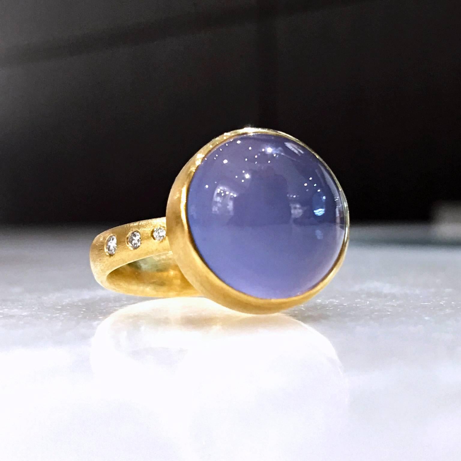 Bubble Ring by award winning jewelry artist Robin Waynee handcrafted in her signature matte finished 18k yellow gold with a bezel-set and cabochon-cut 6.02 carat chalcedony showcasing a phenomenon known as chatoyancy, an optical effect that produces