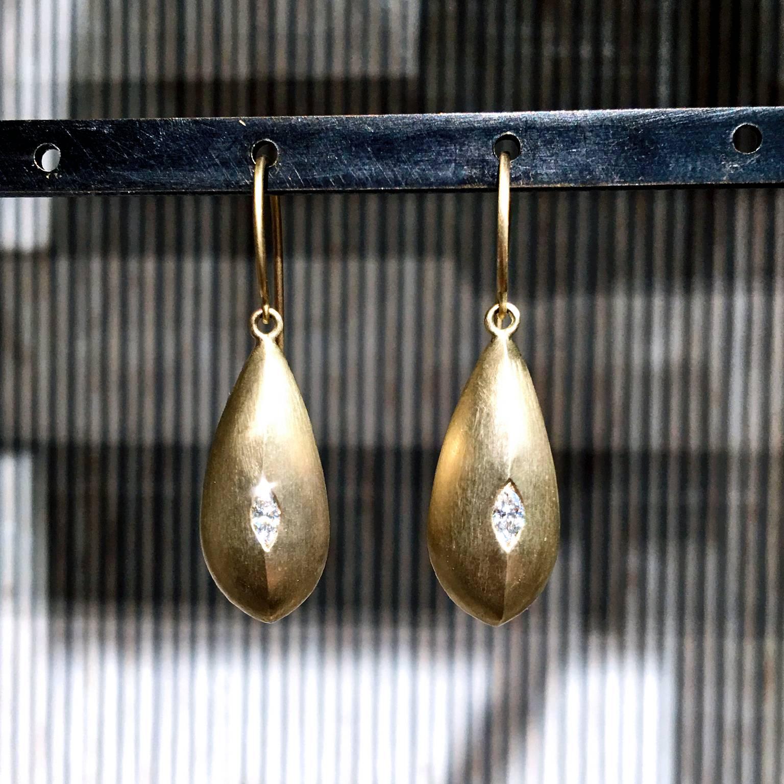 Teardrop Earrings handcrafted in soft matte and satin-finished 10k yellow gold with two bezel-set brilliant-cut marquise white diamonds totaling 0.50 carats.