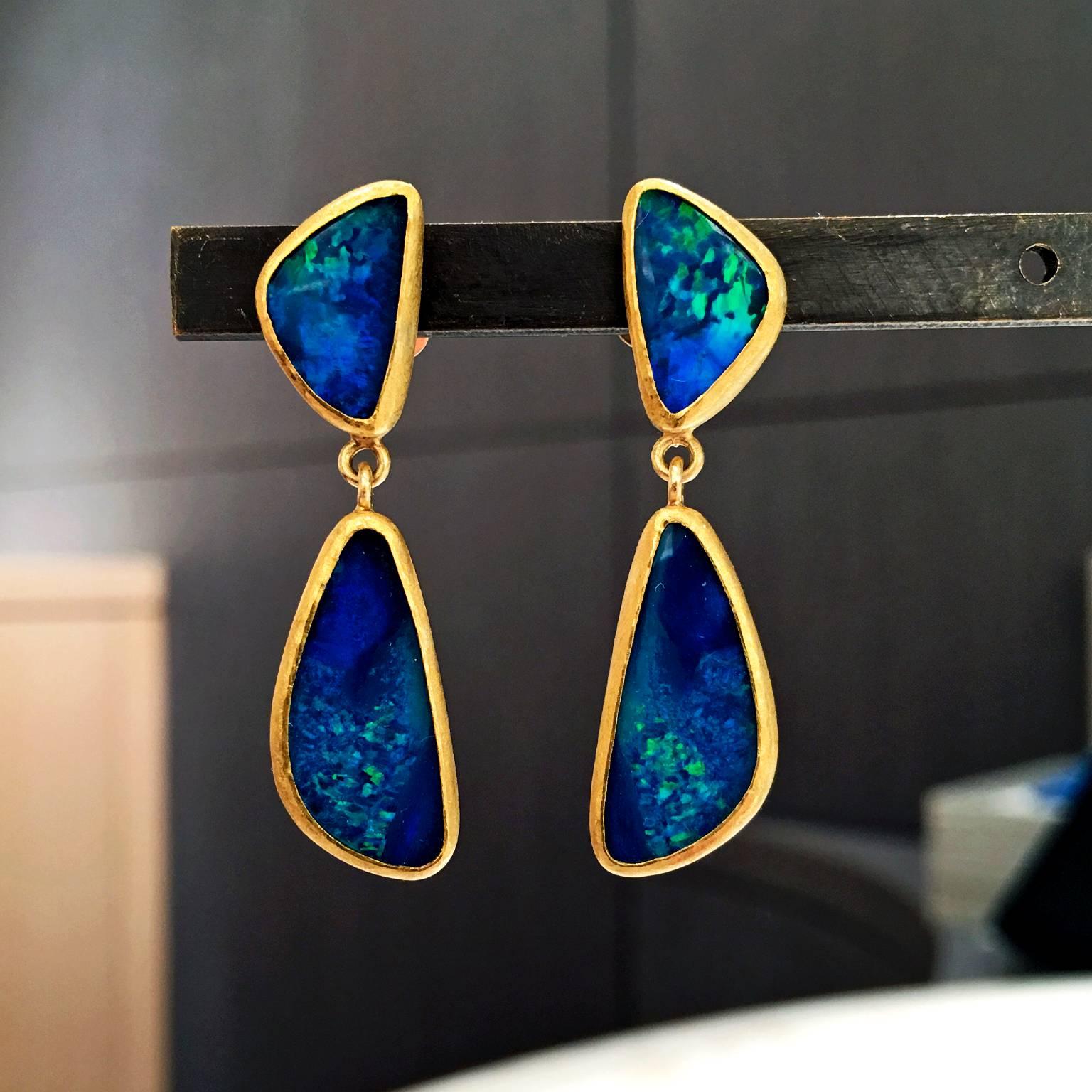 One-of-a-Kind Drop Earrings handcrafted by jewelry artist Petra Class with four matched deep blue Australian opal doublets exhibiting electric green and turquoise flash, bezel-set with Petra's signature matte 22k yellow gold finish on 18k yellow