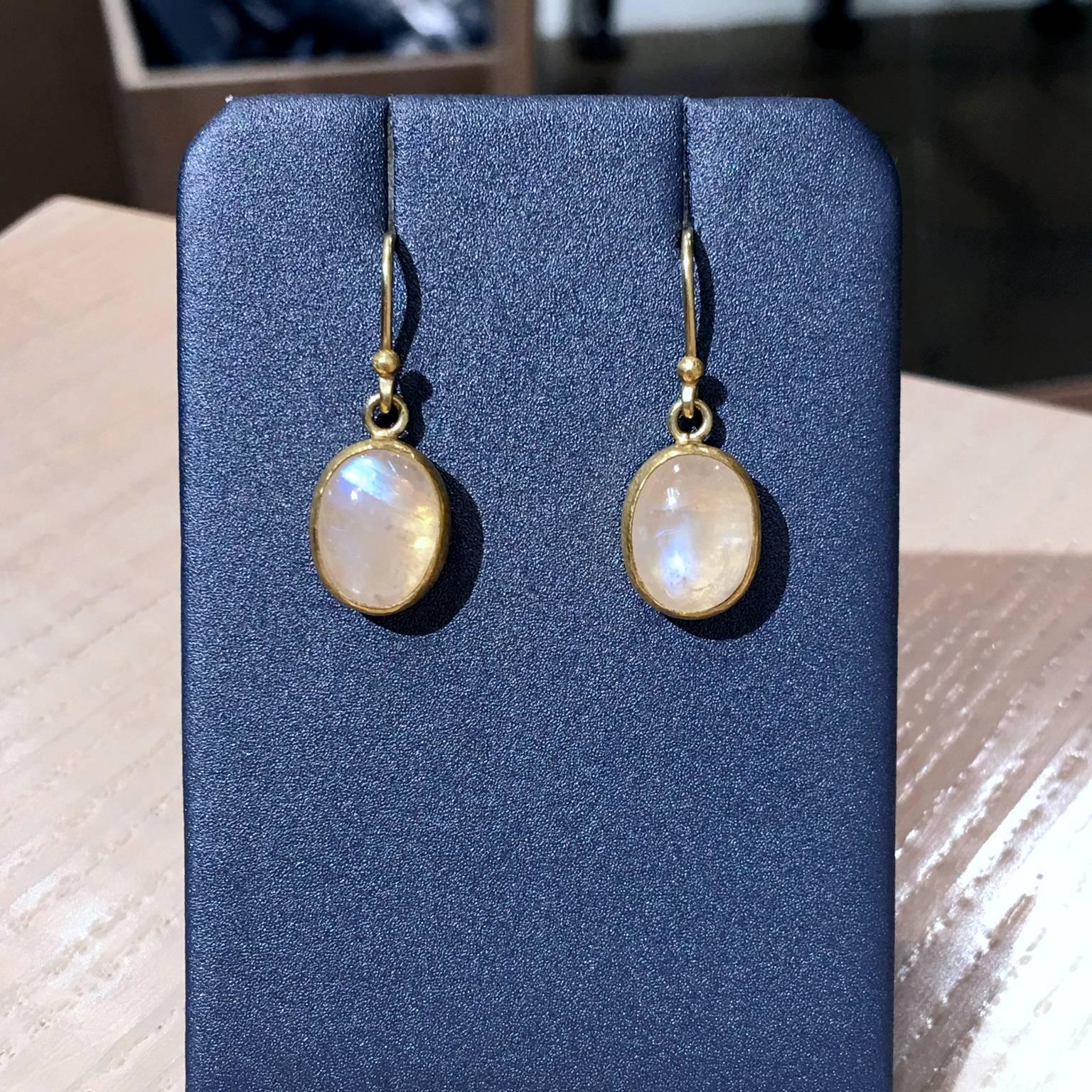 Dangle Drop Earrings by jewelry designer Petra Class handcrafted in her signature finish 22k yellow gold with two bezel-set and cabochon-cut blue moonstones on 18k yellow gold earwires. 

Stamped and Halllmarked 22k / 18k / PC