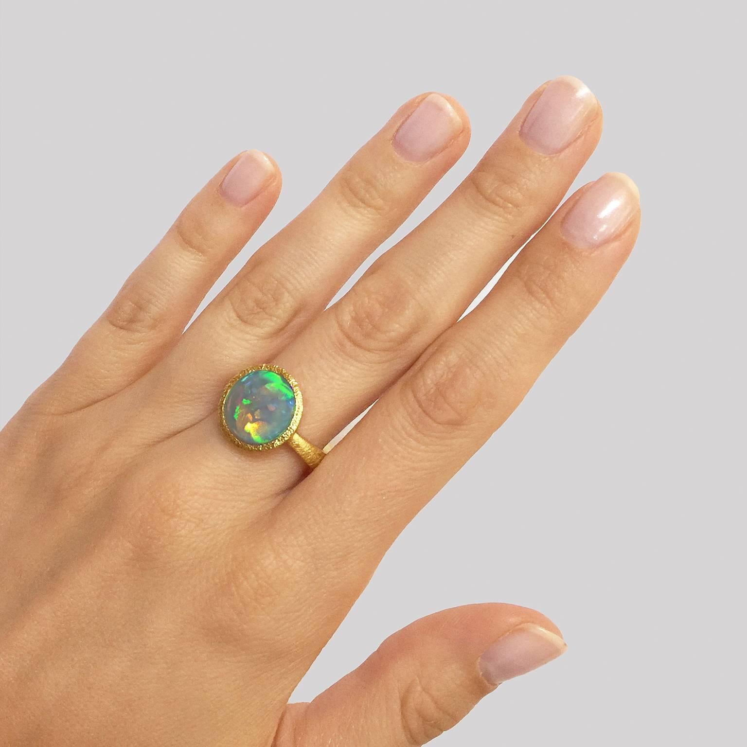 One of a Kind Ring by renowned jewelry artist Devta Doolan showcasing a spectacular and unique opal sourced from Lightning Ridge, Australia, home to the finest black opal mines in the world. The ring is handmade with the gemstone set in a tapered