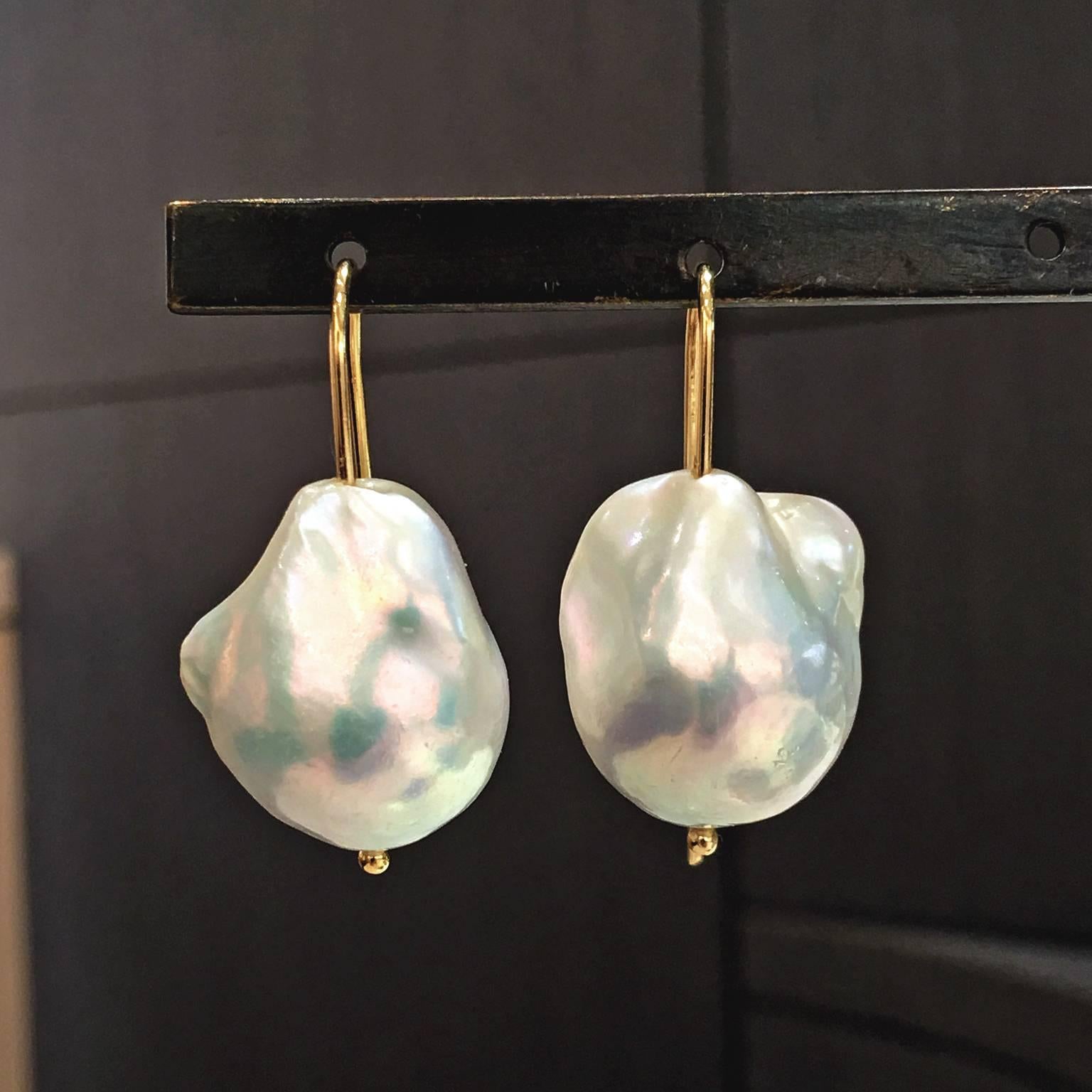 Freshwater Baroque Pearl Drop Earrings by jewelry artist Russell Trusso on handmade 18k yellow gold wires showcasing a pair of colorful, lustrous white freshwater baroque pearls. 