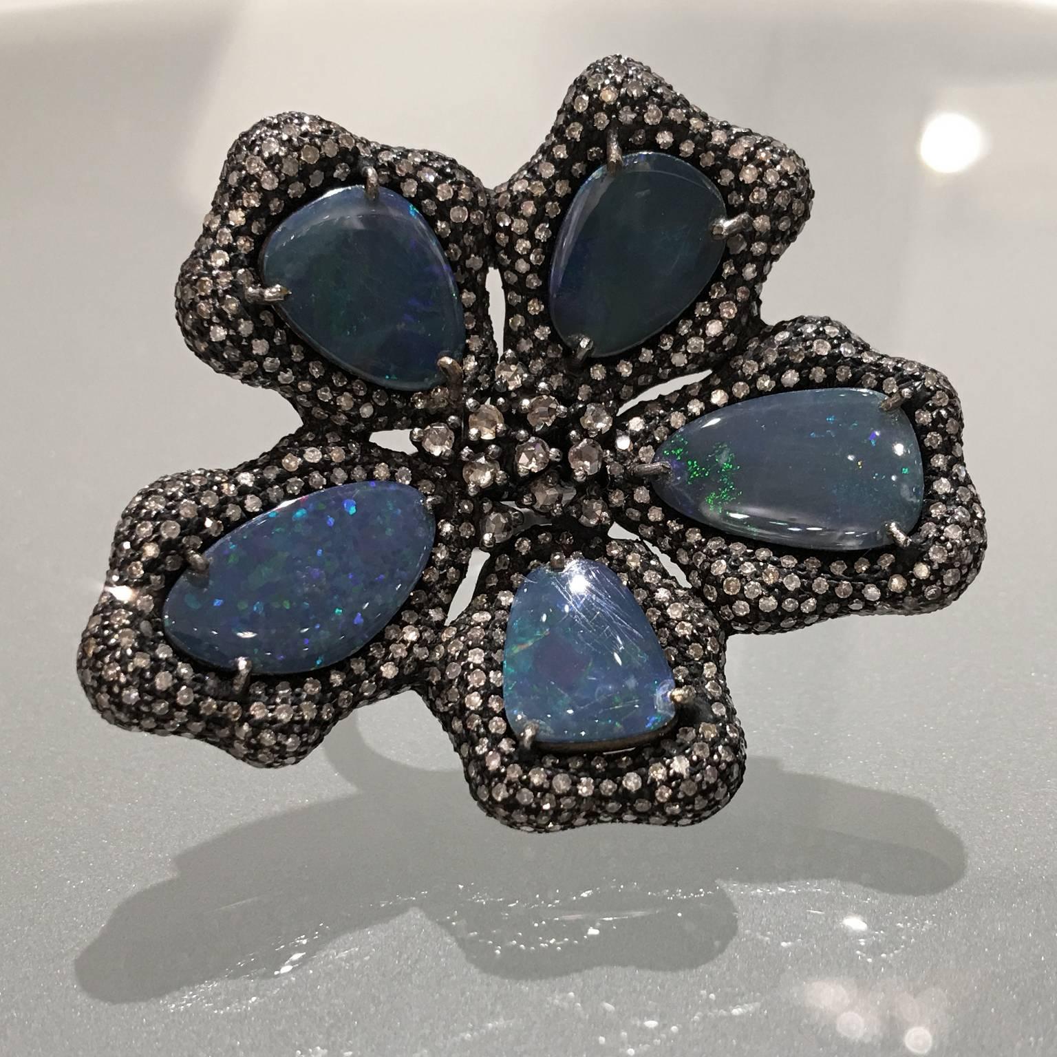 One of a Kind Ring crafted by jewelry designer Fern Freeman in rhodium-finished sterling silver with five black opal doublet petals totaling 11.71 carats and surrounded by 3.57 carats of brilliant-cut and rose-cut diamonds.  Size 7.25 (can be sized).
