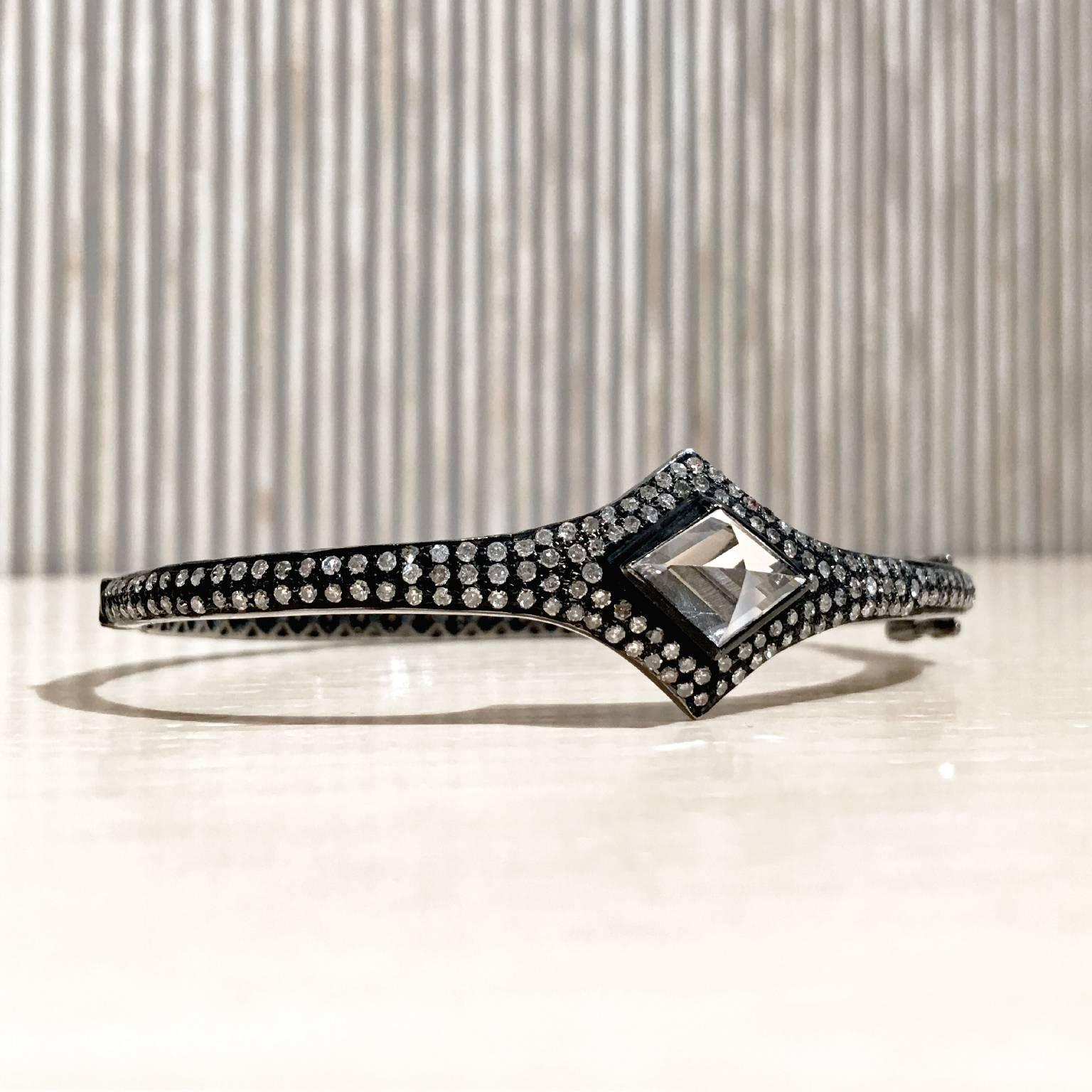 Shimmering Cuff Bracelet handcrafted by jewelry artist Lauren Harper in blackened sterling silver showcasing a unique, prism-cut rock crystal and accented with 2.10 total carats of round brilliant-cut diamonds. 