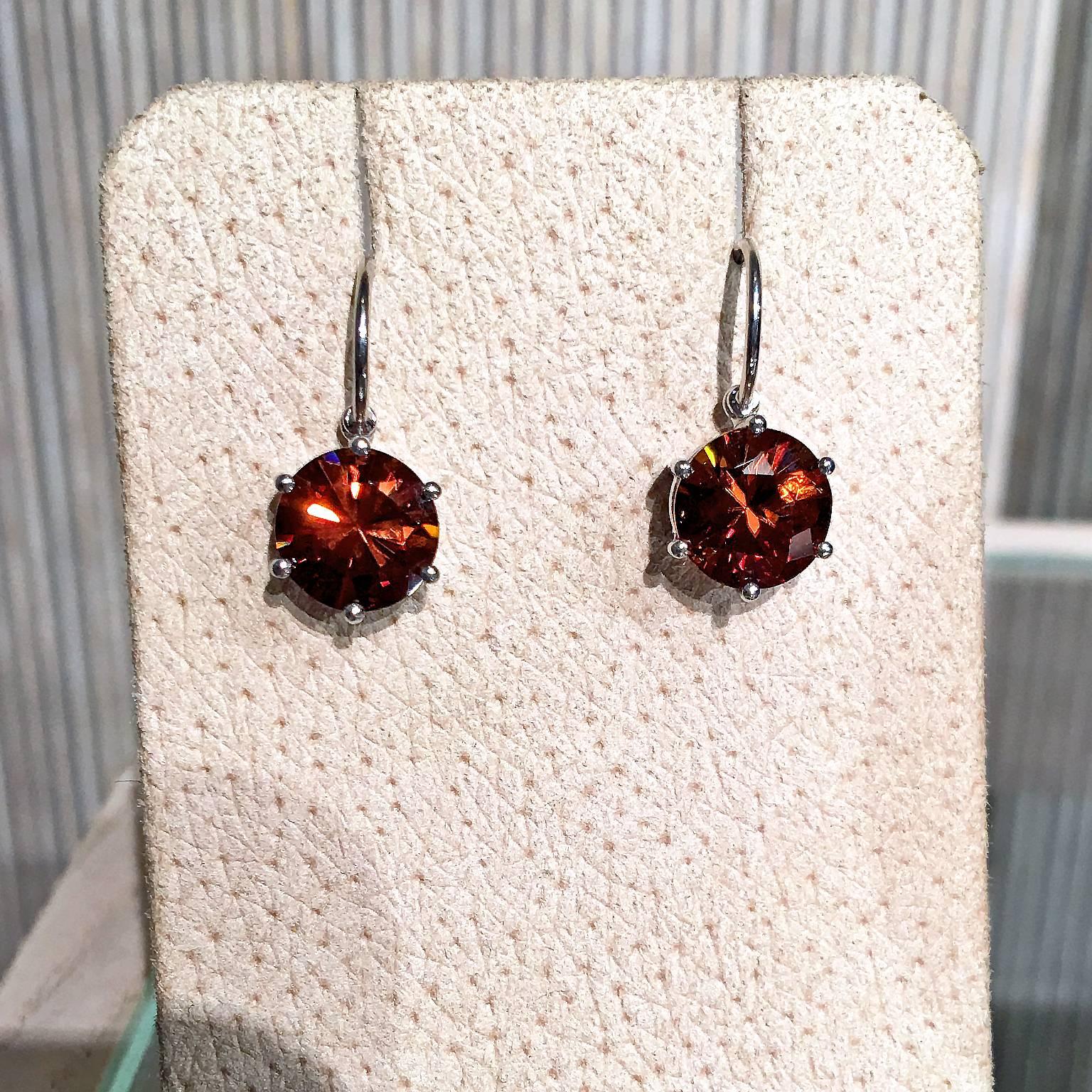 One of a Kind Princess Earrings handcrafted in Germany by master metalsmith and award winning jewelry artist Erich Zimmermann in 18k white gold with a brilliant 9mm matched red zircon pair showcasing incredible fire.

Stamped 750 with Erich's