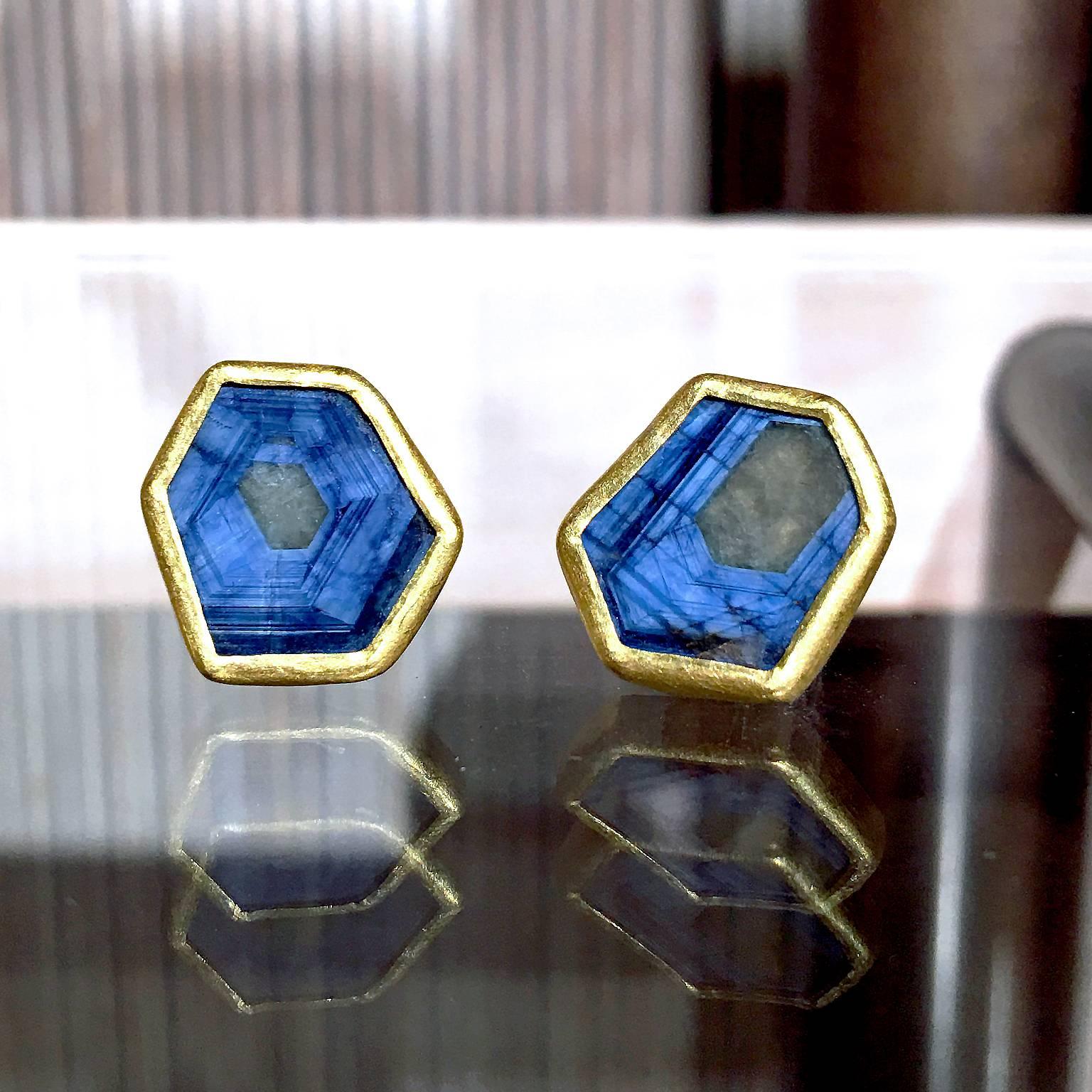 One of a Kind Studs handmade by jewelry designer Petra Class in matte-finished 22k yellow gold with two blue sapphire slices that have a unique, understated glow. On 18k yellow gold posts.

Stamped and Hallmarked 18k / 22k / PC