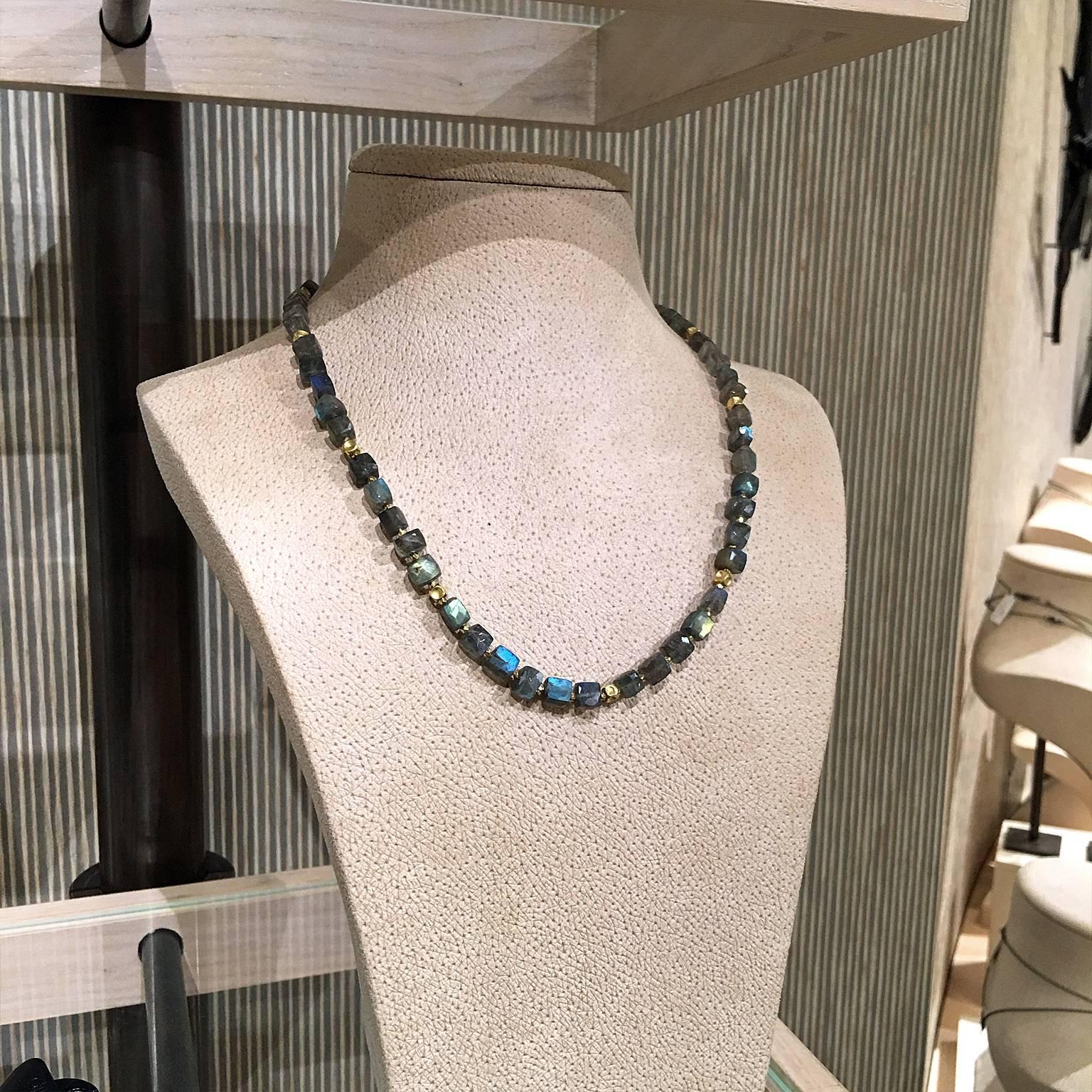One of a Kind Necklace handcrafted by award winning jewelry maker Barbara Heinrich showcasing matched labradorite cubes with strong, colorful flash. The gemstones are individually separated by matte-finished 18k yellow gold handmade faceted bead and