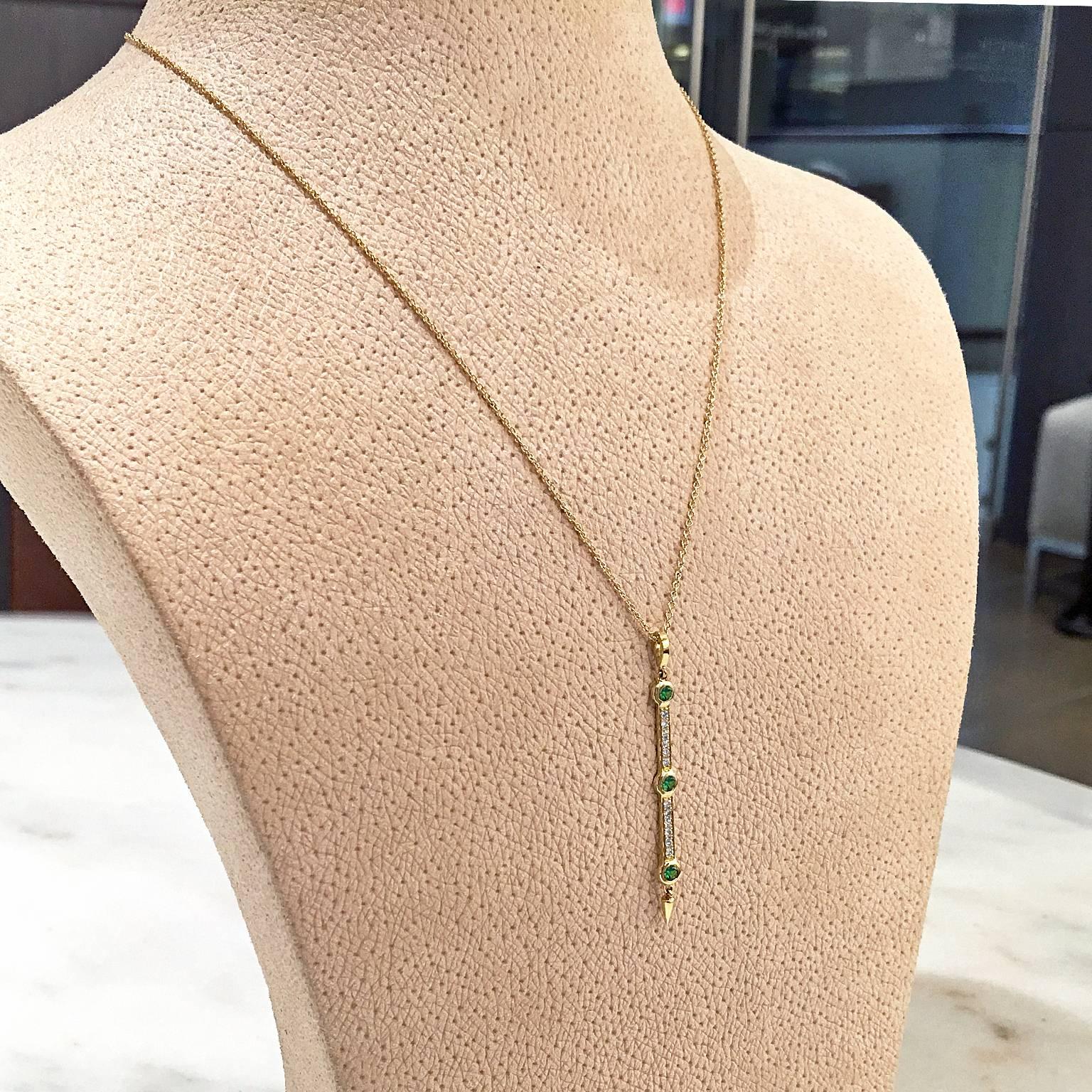 Dagger Drop Necklace featuring a pendant handcrafted in 18k yellow gold set with 0.17 total carats of ethically-sourced Tanzanian tsavorite garnets and 0.12 carats of round brilliant-cut white diamonds on a 16" 18k yellow gold chain. Total