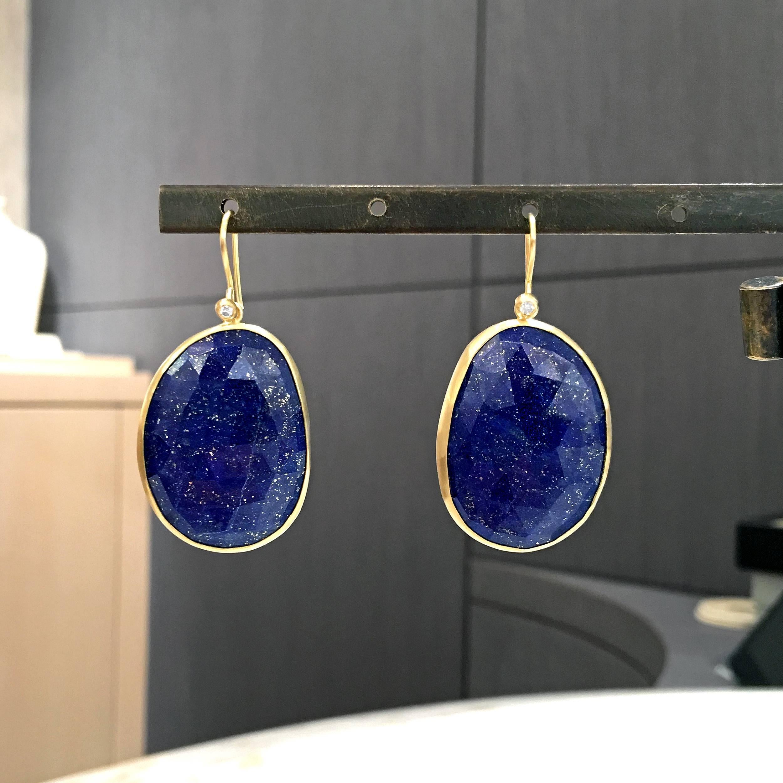 One of a Kind Earrings handcrafted by jewelry artist Monica Marcella in matte-finished 18k yellow gold with an absolutely spectacular matched pair of faceted, violet blue lapis lazuli with shimmering gold pyrite flecks. The lapis is accented by two