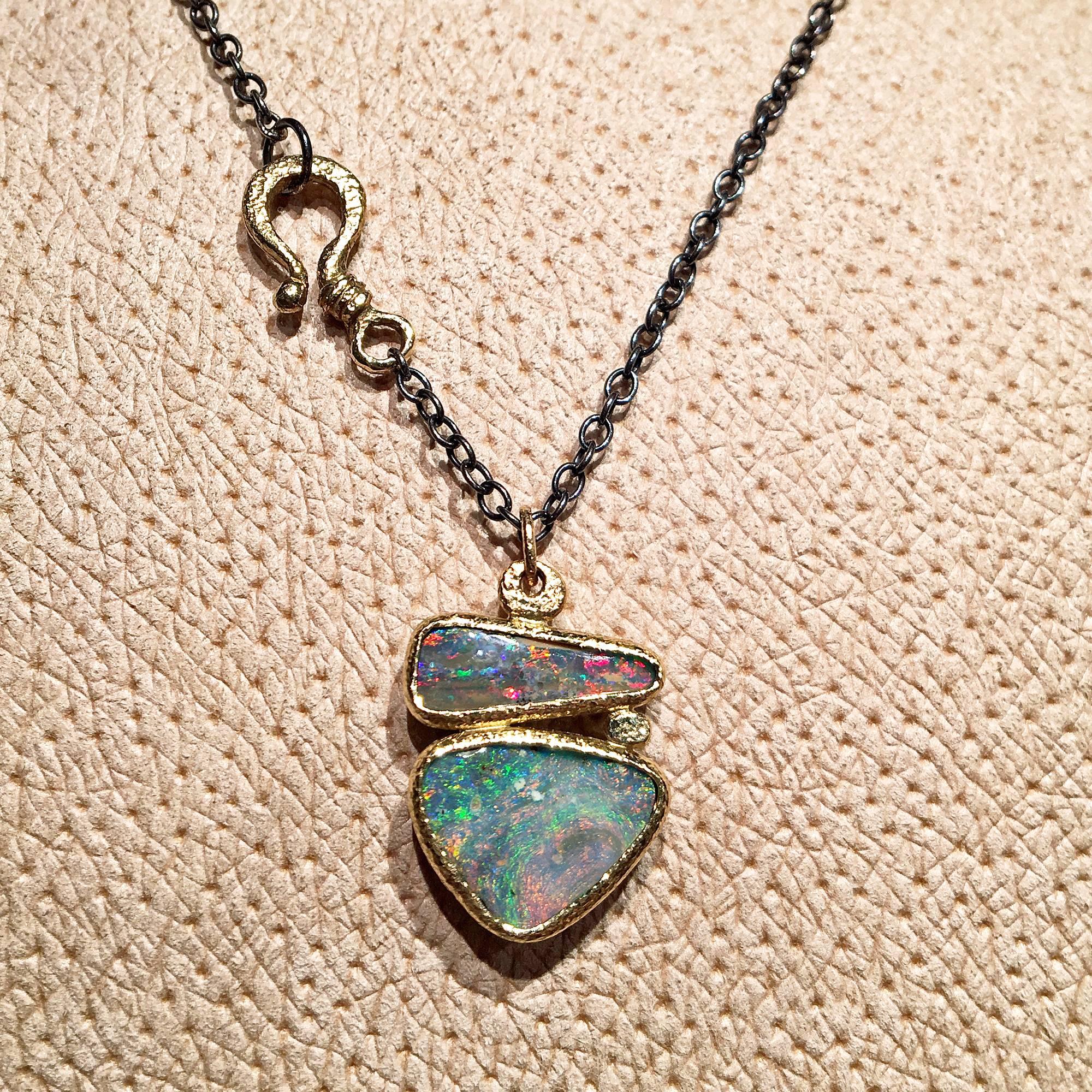 One of a Kind Necklace handcrafted by jewelry artist Rona Fisher featuring two gorgeous Australian boulder opals with magnificent color, bezel-set in beautifully-textured 18k yellow gold on an oxidized sterling silver link chain (16 inches + 1 inch