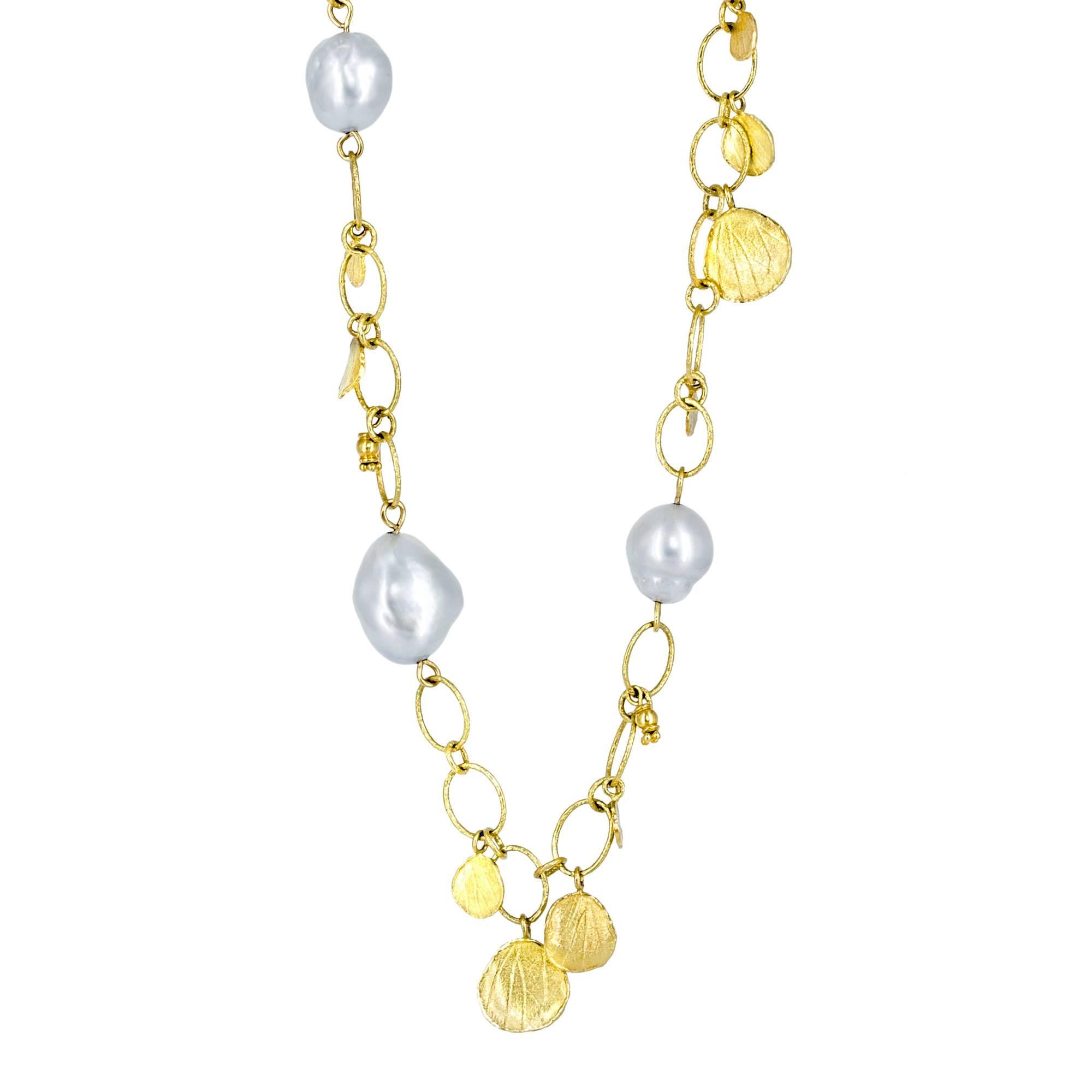 Petals Necklace handcrafted by jewelry artist Barbara Heinrich on a handmade specially-finished 36.25 inch long 18k yellow gold oval and round link chain, featuring eleven lustrous light silvery blue baroque pearls and accented by forty-one