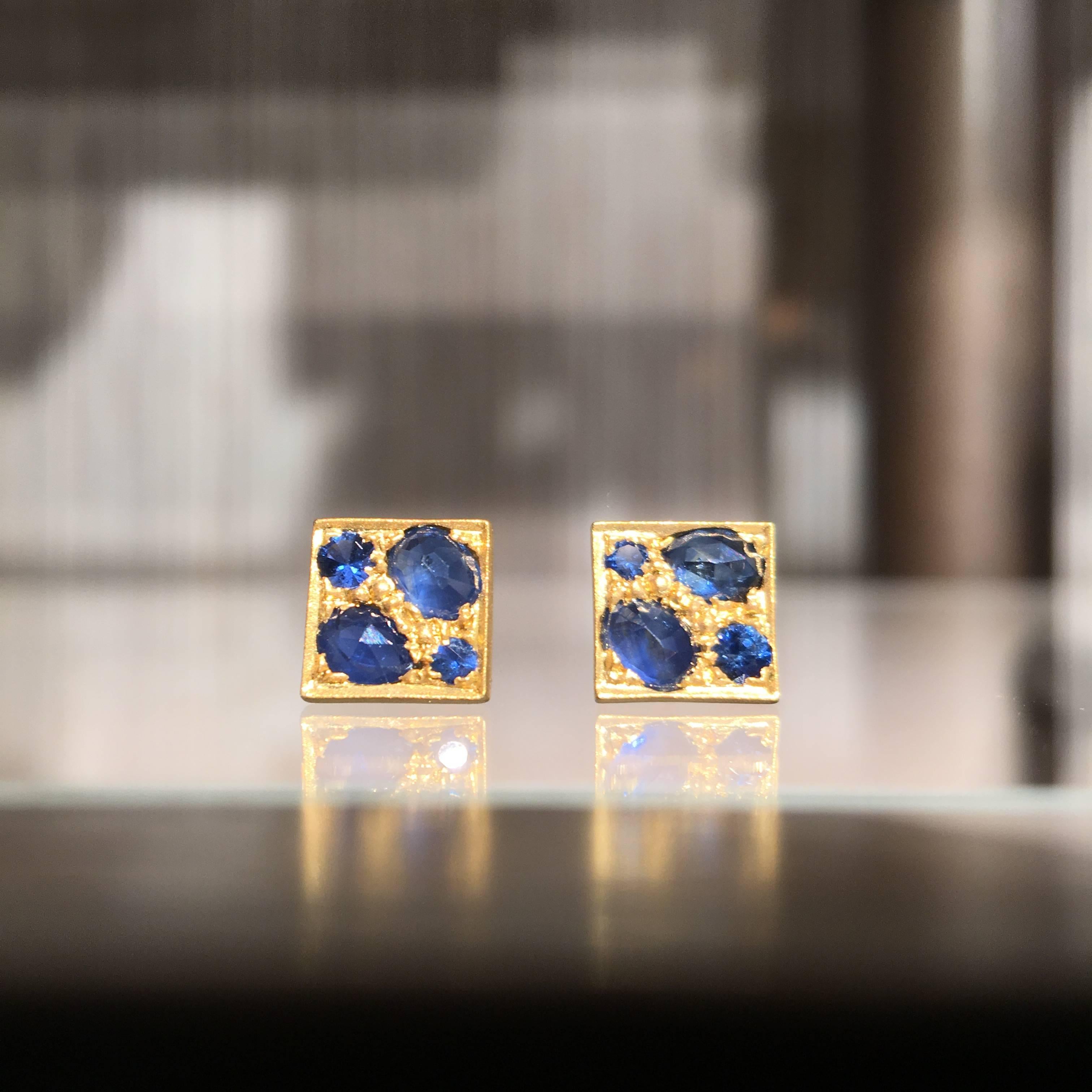 Quad Stud Earrings handcrafted by jewelry artist Lauren Harper in matte-finished 18k yellow gold featuring eight natural faceted blue sapphires surrounded by granulation and raised border. 
