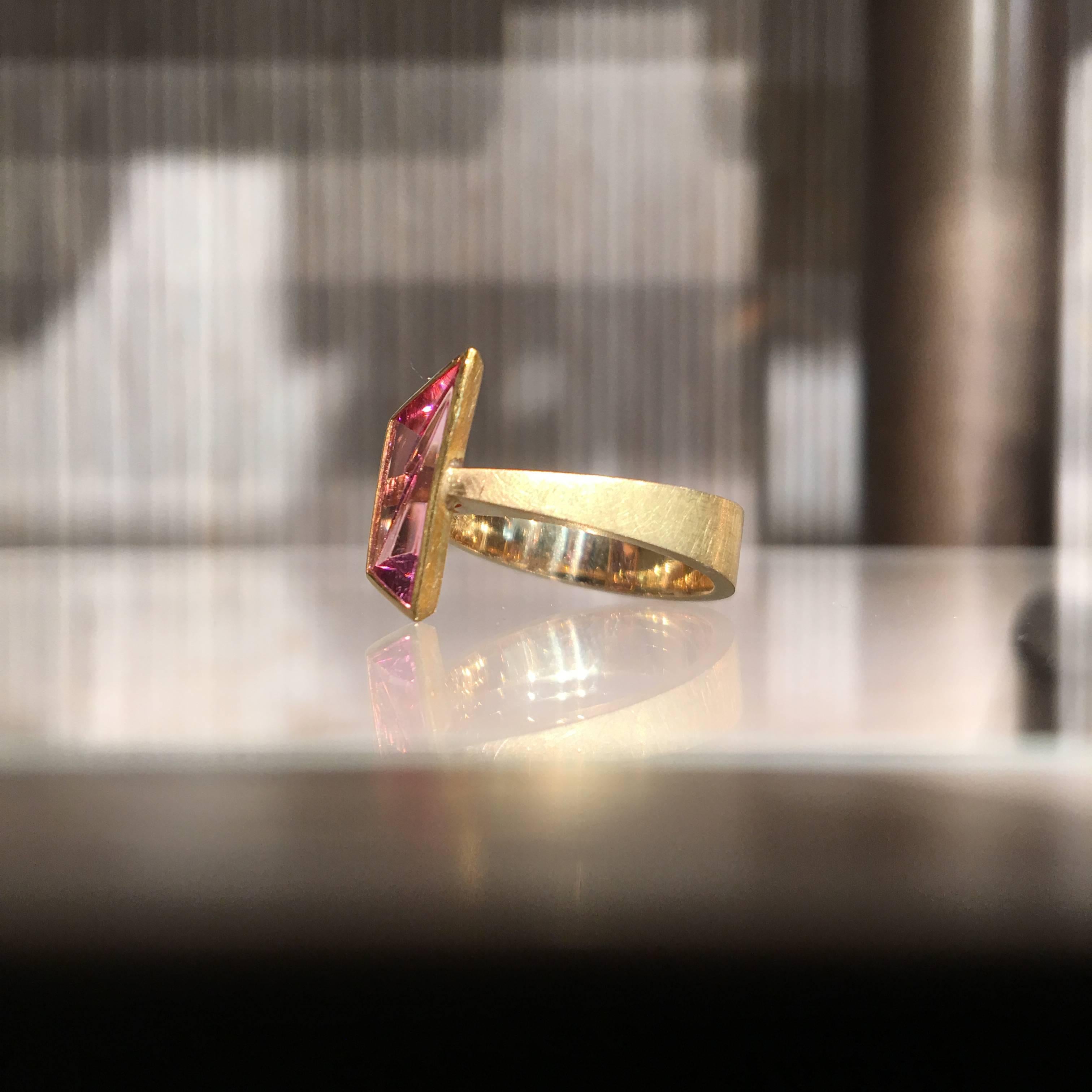 One of a Kind Ring handcrafted in Barcelona, Spain by jewelry artist Enric Majoral in highly textured and matte-finished 18k yellow gold showcasing a gorgeous pink tourmaline hand-cut in Germany by the "Picasso of Gems", Atelier