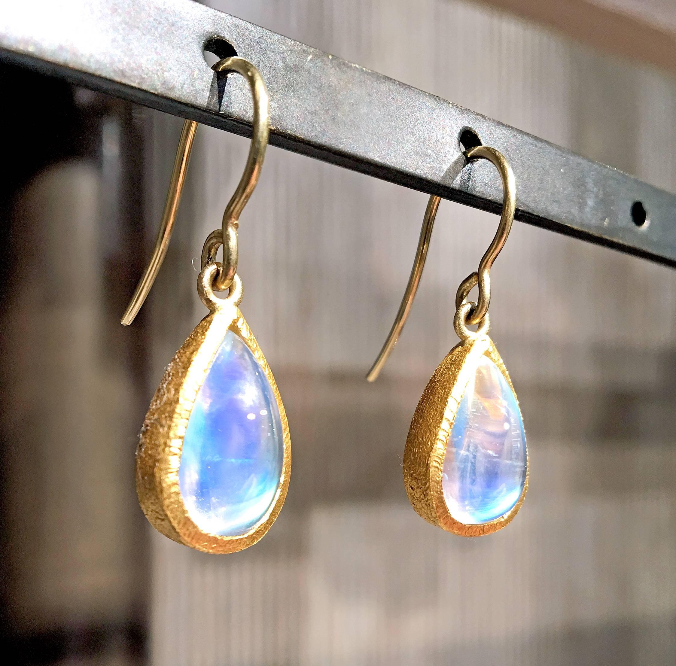 Dangle Drop Earrings handcrafted by jewelry designer Devta Doolan in his signature 22k yellow gold finish featuring a matched pair of superior quality rainbow moonstones with exceptional color and glow. On 18k gold wires. Stamped and Hallmarked 22k