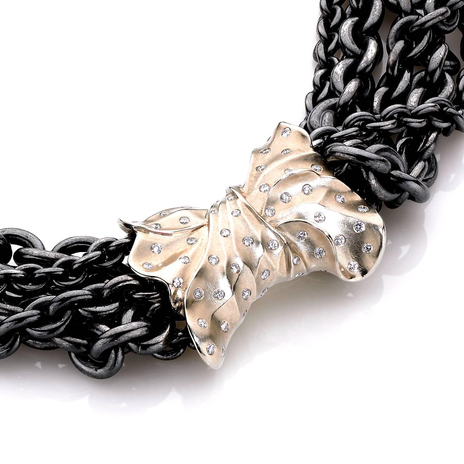 Bow Necklace handcrafted by jewelry artist Pedro Boregaard featuring a handmade 18k beige gold bow clasp embedded with 0.85 total carats of shimmering round brilliant-cut white diamonds and attached to an array of oxidized sterling silver wrapped