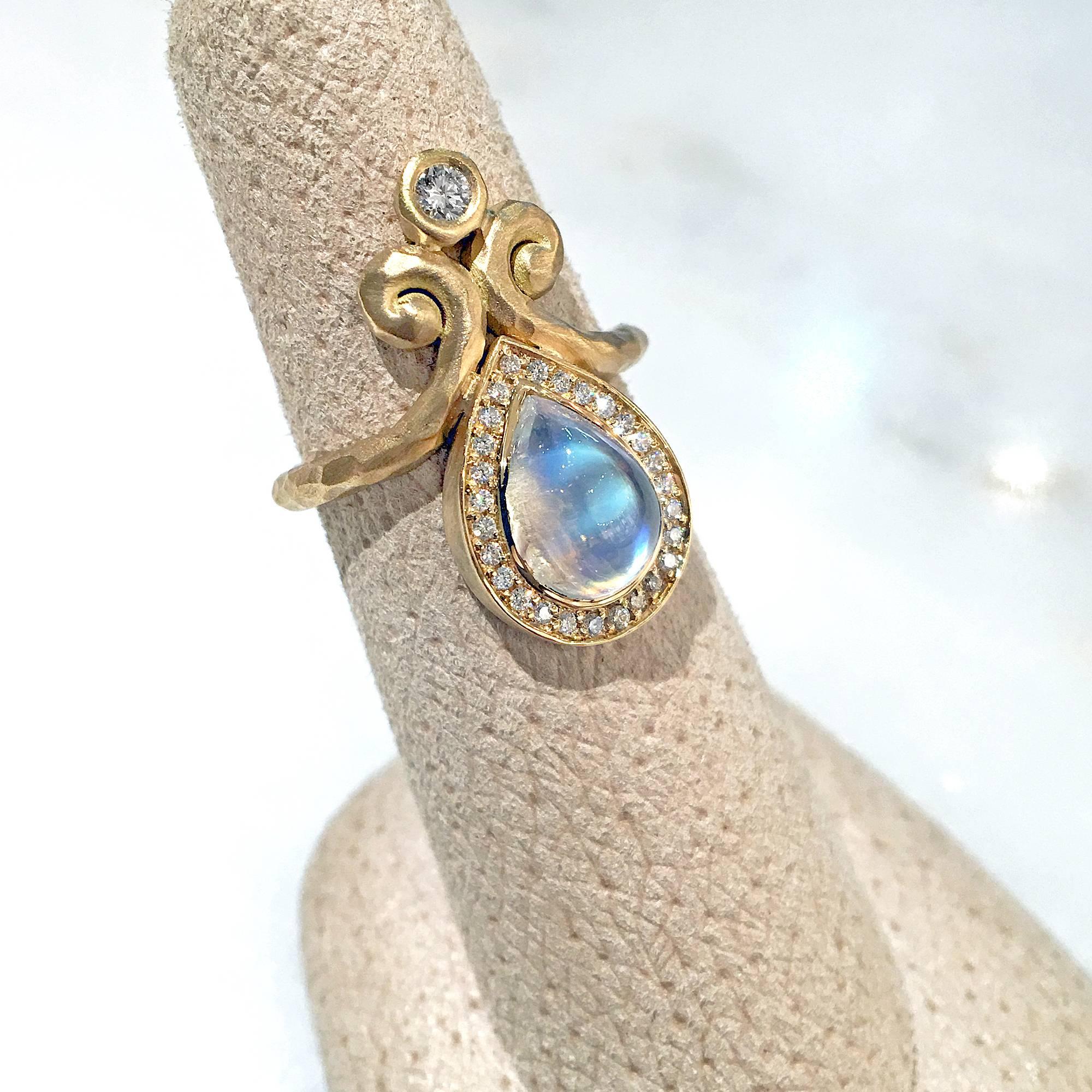 One of a Kind Ring handcrafted by jewelry designer Pamela Froman in hand-hammered 18k yellow gold featuring a spectacular 2.79 carat pear-shaped rainbow moonstone cabochon surrounded by a pave' diamond bezel and accented with a substantial round
