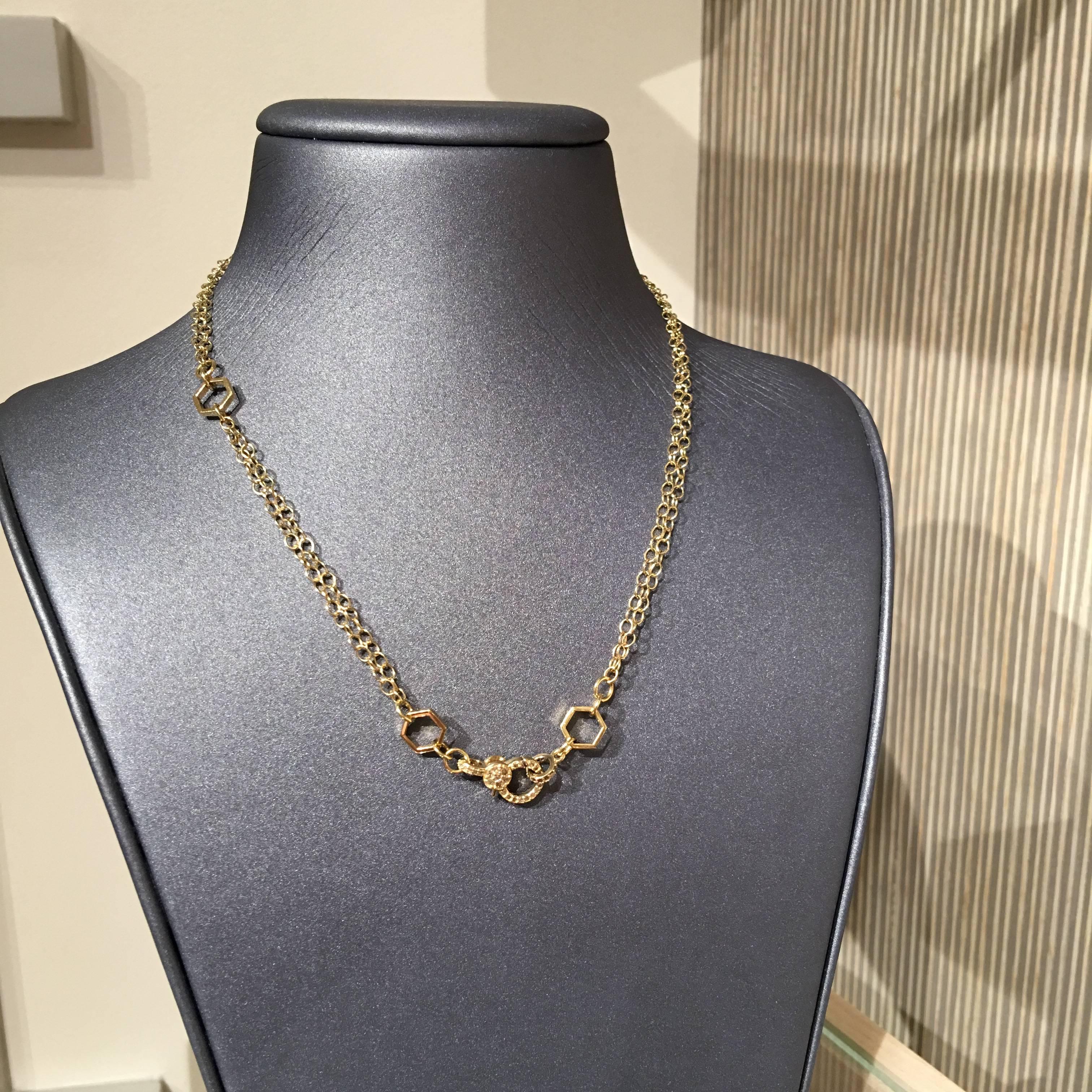 Multi-functional Necklace handcrafted by jewelry designer Fern Freeman in New York in 14k yellow gold featuring an ornamental double-sided clasp embedded with 0.28 total carats of diamonds and accented with three open hexagonal elements that allow