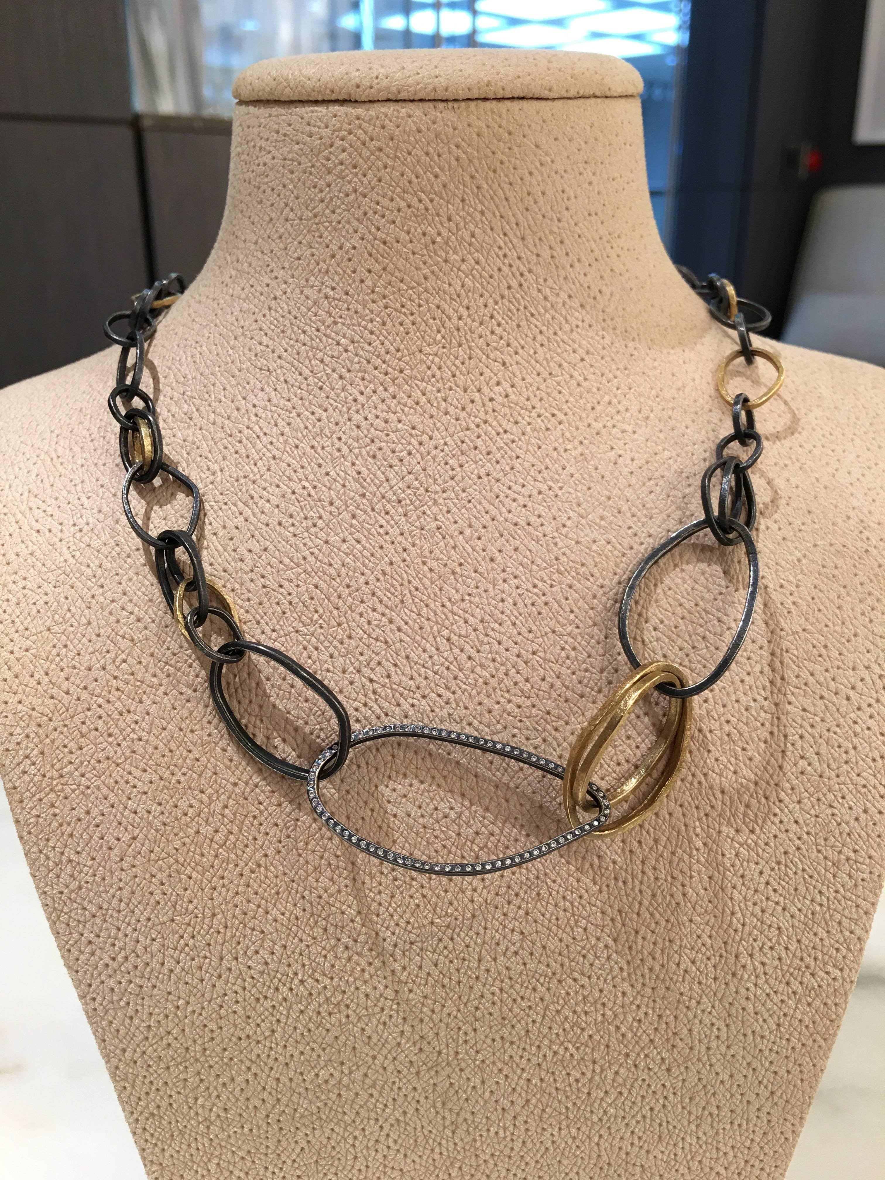 Elemental Links Necklace handcrafted by award-winning jewelry designer Todd Reed featuring assorted signature-finished 18k yellow gold and patina sterling silver links featuring a single link embedded with round brilliant-cut white diamonds totaling