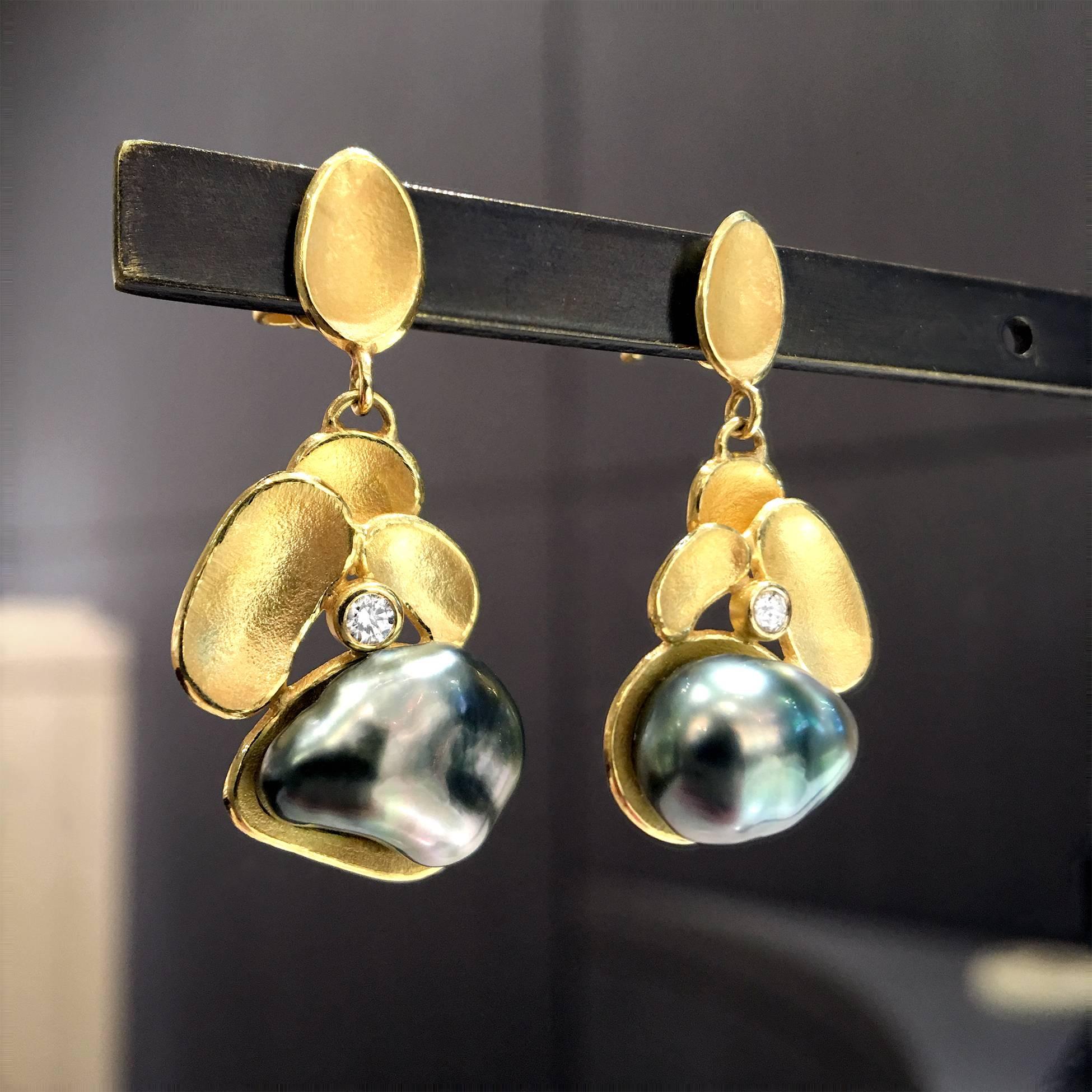 One of a Kind Petal Drop Earrings handmade in signature matte-finished 18k yellow gold by acclaimed jewelry artist Barbara Heinrich featuring two stunning, strongly iridescent dark gray Tahitian Keshi pearls and accented with two round brilliant-cut