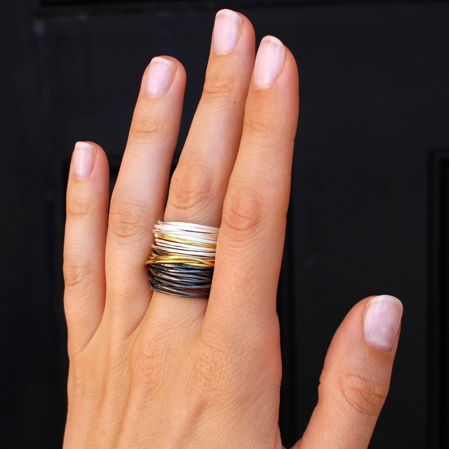 Three Strand Spaghetti Grande Wrap Ring handcrafted by London jewelry artist Disa Allsop in 18k yellow gold, oxidized sterling silver, and bright sterling silver. Size 8 (special order available in other sizes).