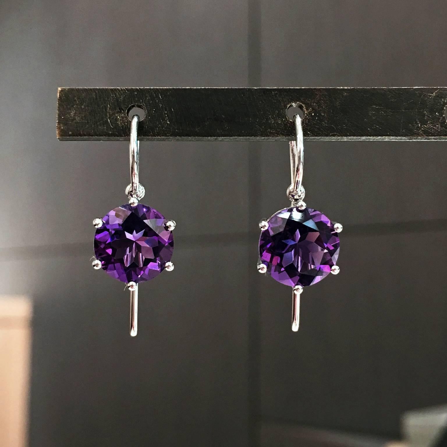 Princess Earrings, handcrafted by acclaimed German jewelry artist and master metalsmith Erich Zimmermann, in 18k white gold with a gorgeous, fiery matched pair of 9mm violet amethyst totaling 6.80 carats set with six ball prongs in an open basket