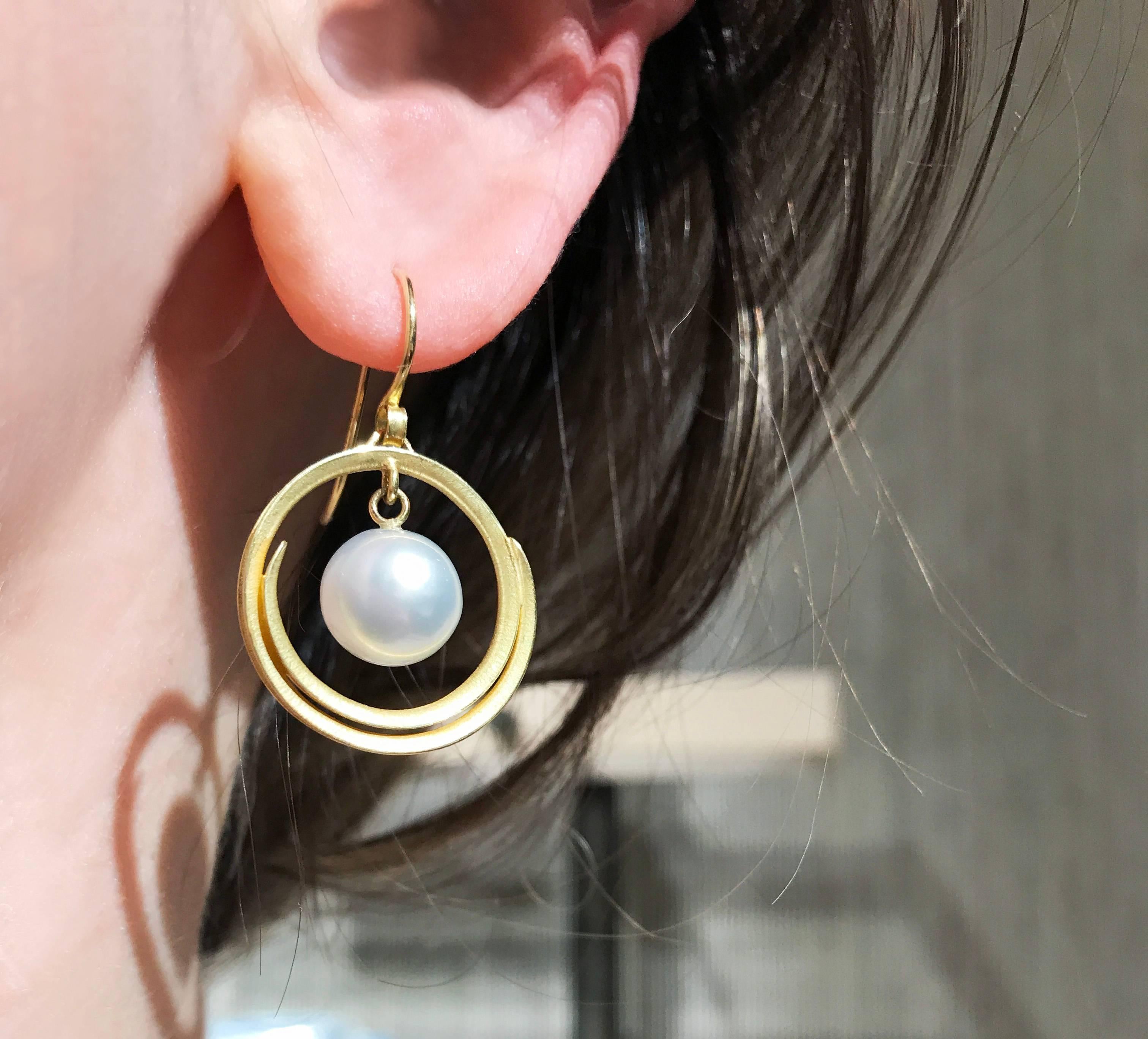 Open Spiral Swirl Drop Earrings handmade by jewelry artist Barbara Heinrich in signature-finished 18k yellow gold featuring two dangling white South Sea pearls and stamped and hallmarked 18k gold wires. 