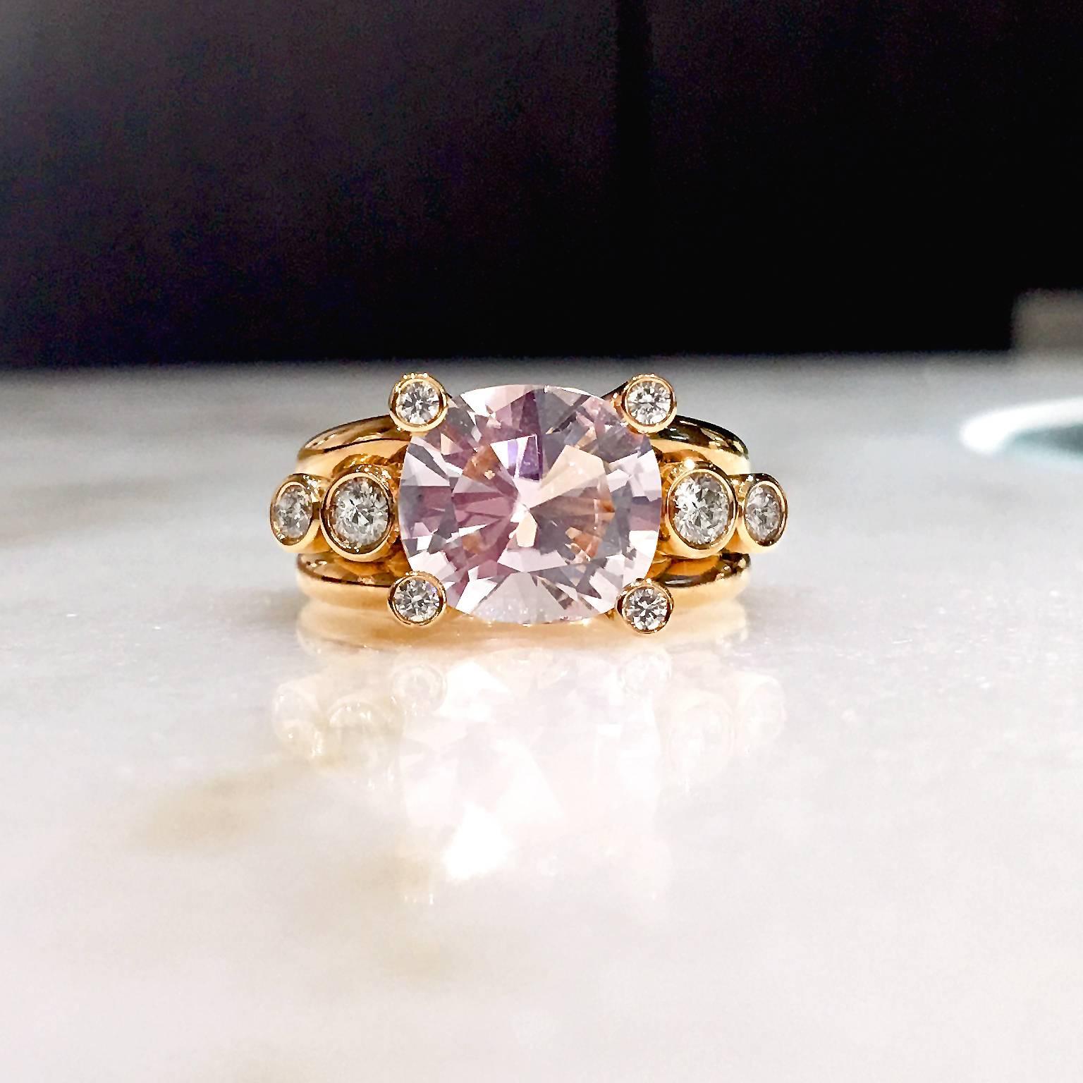 One-of-a-Kind Hollywood Ring handcrafted in Germany by master metalsmith Erich Zimmermann in 18k rose gold, showcasing a bezel-set 5.06 carat cushion-cut rose kunzite accented by eight tube bezel-set, assorted sized round brilliant-cut white