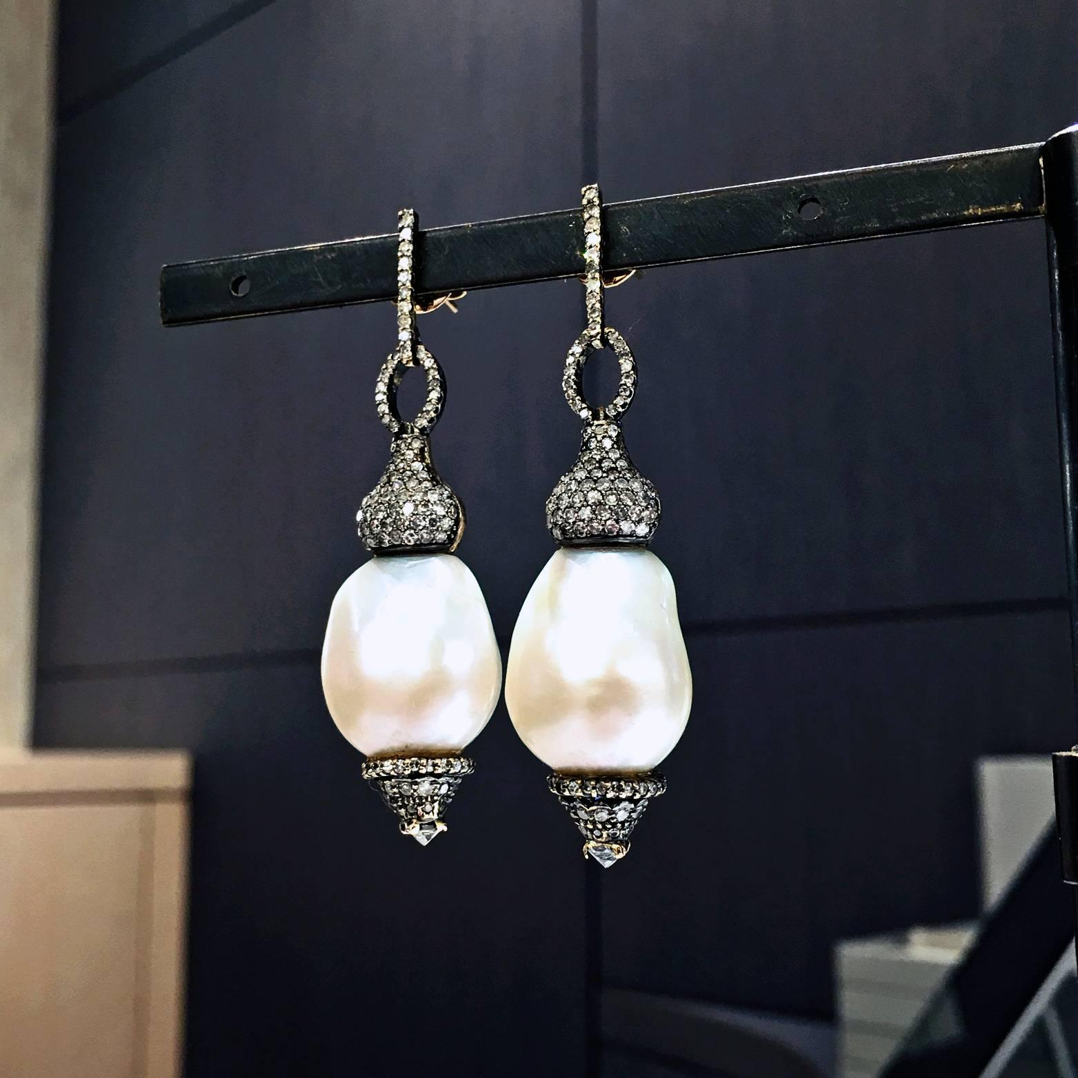 One-of-a-Kind Hollywood Drop Earrings handcrafted in 14k blackened white gold, 14k yellow gold, and sterling silver featuring two lustrous white baroque pearls and accented with 3.2 total carats of brilliant-cut diamonds.
