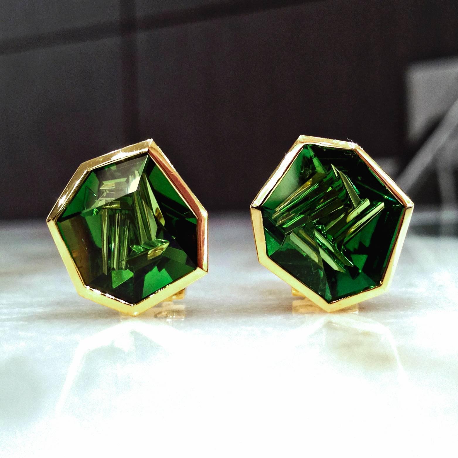 One-of-a-Kind Earrings handcrafted by Atelier Munsteiner in satin-finished 18k yellow gold with 8.18 total carats of externally faceted and internally abstract-cut green tourmaline and 18k yellow gold posts and clip. 