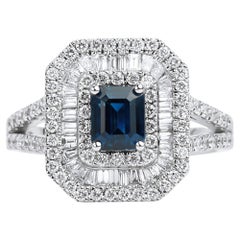 1.06ct Emerald-Cut Blue Sapphire Triple Halo Engagement Ring in 18K White Gold