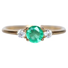 Round Emerald and Diamond Three-Stone Ring in 18K Yellow Gold