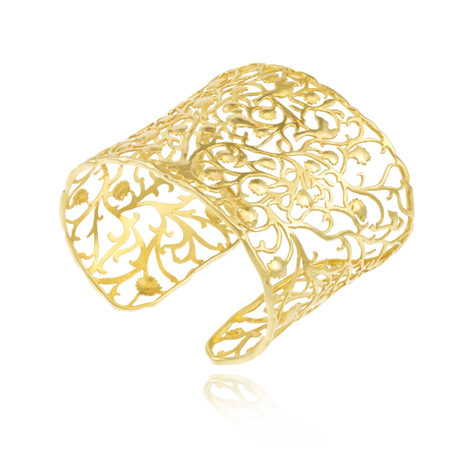 This cuff, made from gold filigree, wraps the wrist and tells a story. One which has always fascinated Pippa, that of the Tree of Life. An image found all over the World, a tale of the tree that shades and provides food for all creatures, holding
