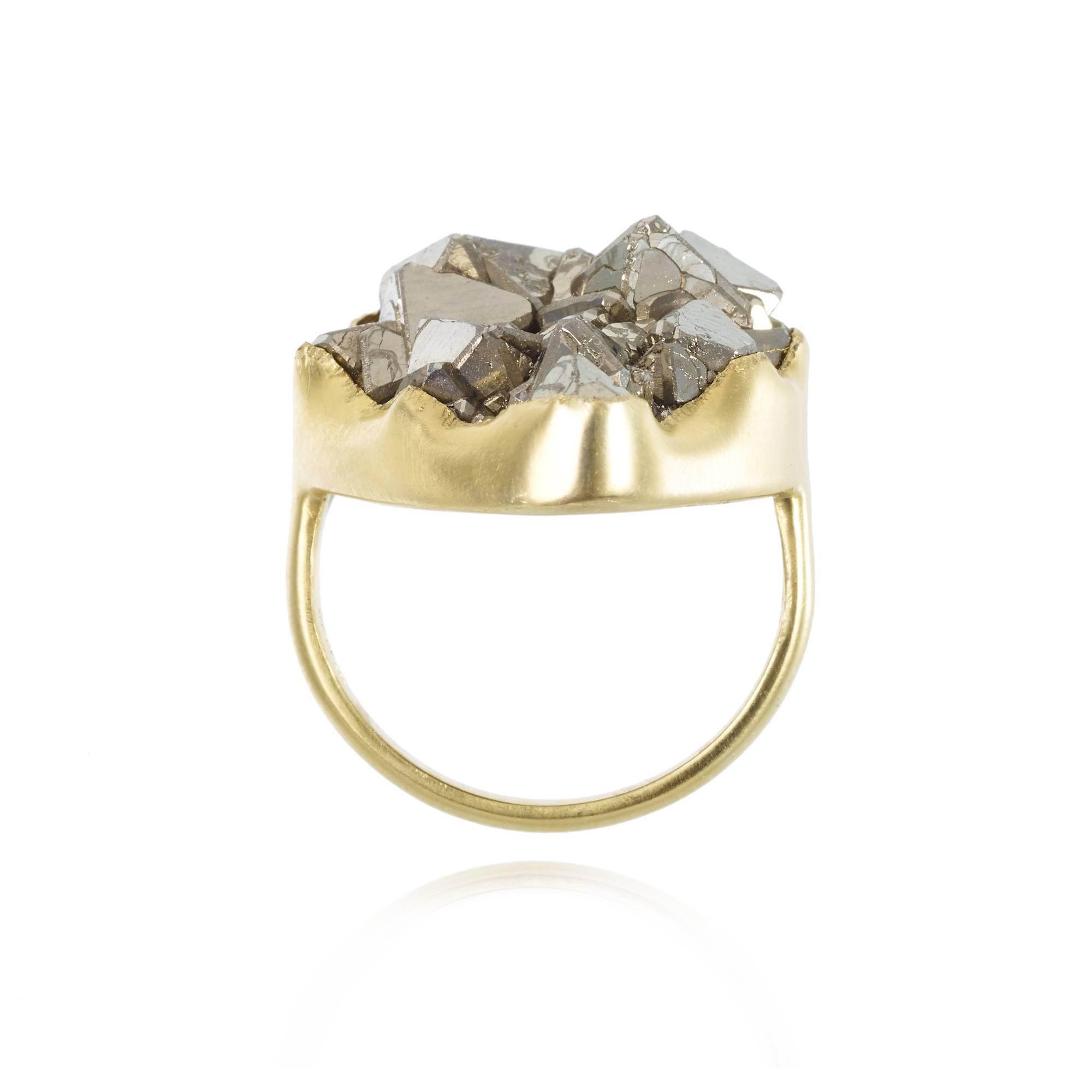 The 18kt Gold Greek ring, inspired by the simplicity of ancient Greek Gold work, Is a classic Pippa Small design. The Gold setting is discrete allowing the beautiful Pyrite stone to shine. 