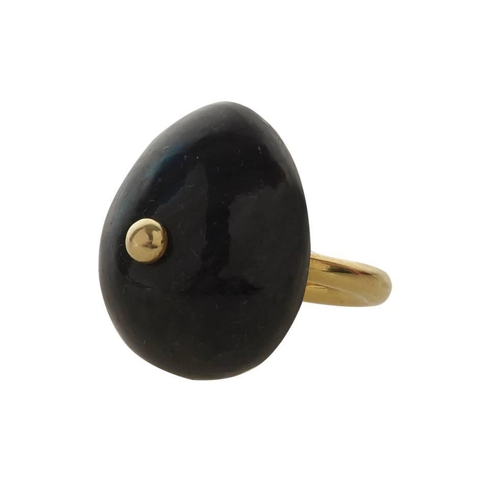 Featuring a large, carefully-sourced semi-precious Labradorite as the focus of this stunning hand-crafted piece, this 18-kt Gold piece is truly striking.

Width of Stone: 20mm </br>
Rings can also be sized to fit.