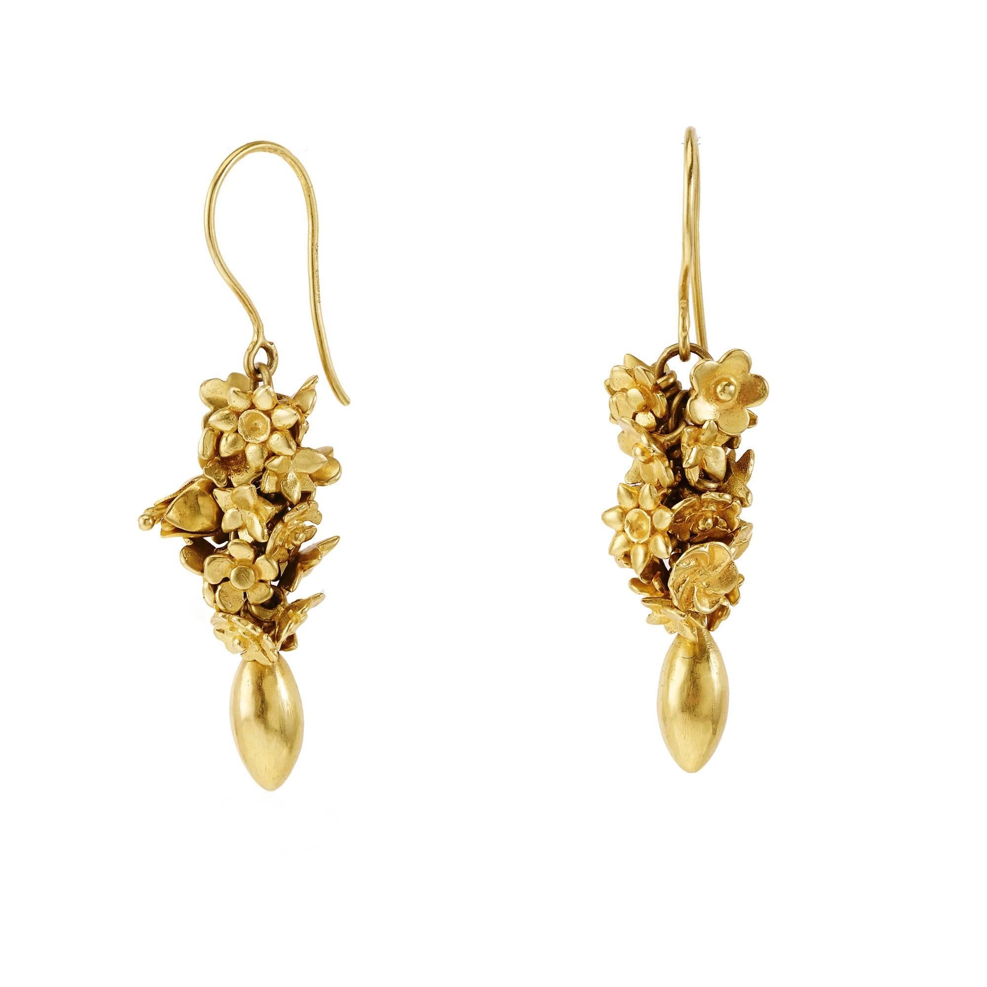 Made from a mixture of tiny cast flowers including bluebells and daisies carefully chosen by Pippa these 18kt gold earrings hang perfectly from the lobe. 

Length of Drop: 42mm