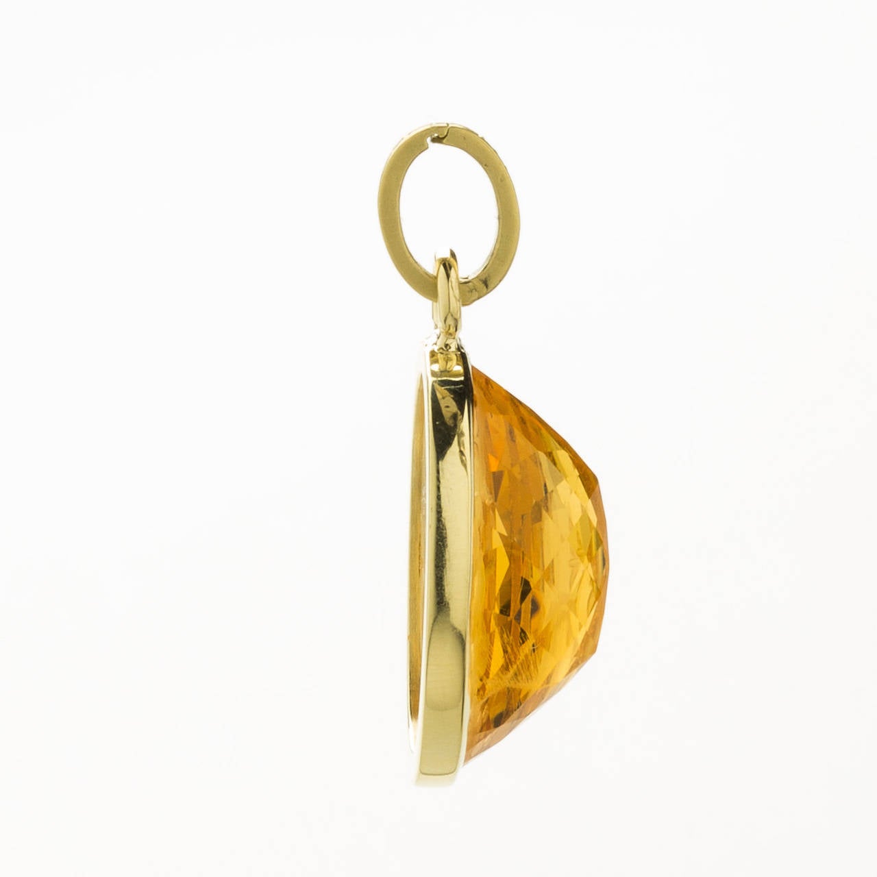 This exquisite hand carved citrine intaglio of Aphrodite created by a Master Idar-Oberstein artist. This deep faceted gemstone pendant is set in a polished 18 karat yellow gold frame with loop.  Included with a detachable hand cast 18K brushed