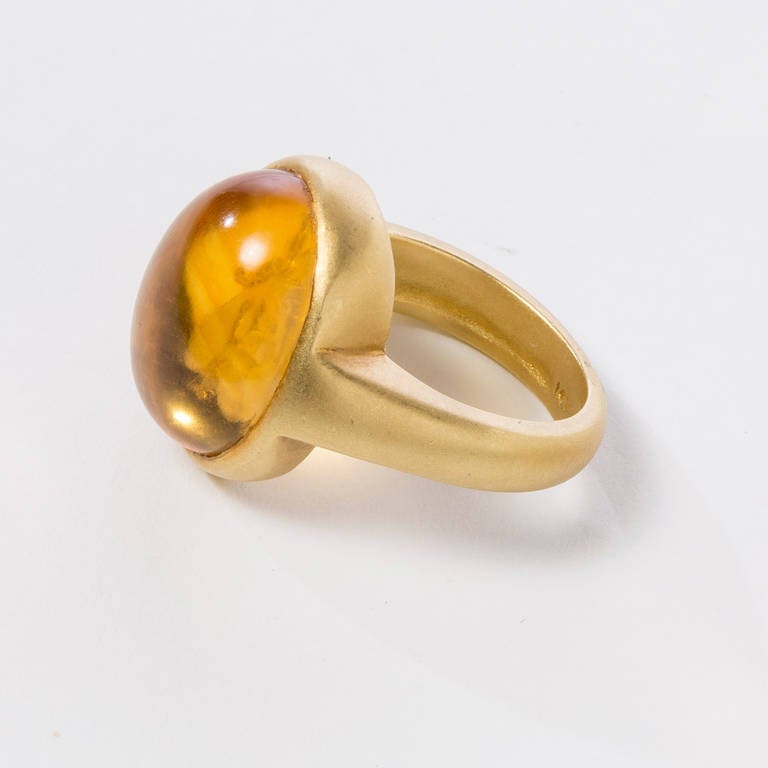 This lovely hand carved citrine bee intaglio ring (by master Idar-Oberstein carver) looks to be suspended in time. It is set in 18 karat brushed gold. 16x12x8mm cabochon size. Ring size 6 1/2.
Intaglios also available in a variety of stones:beryl,