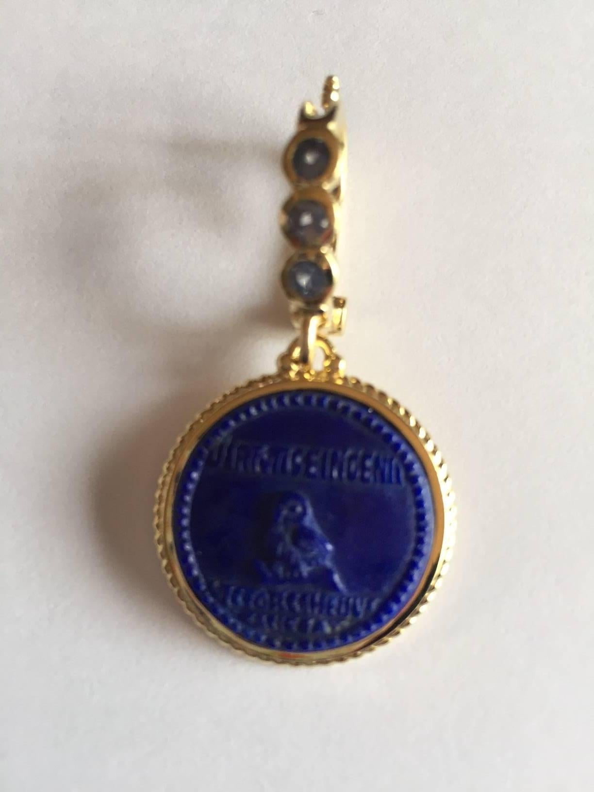 18 karat athena owl carved lapis lazuli intaglio with .30 carat sapphire bail