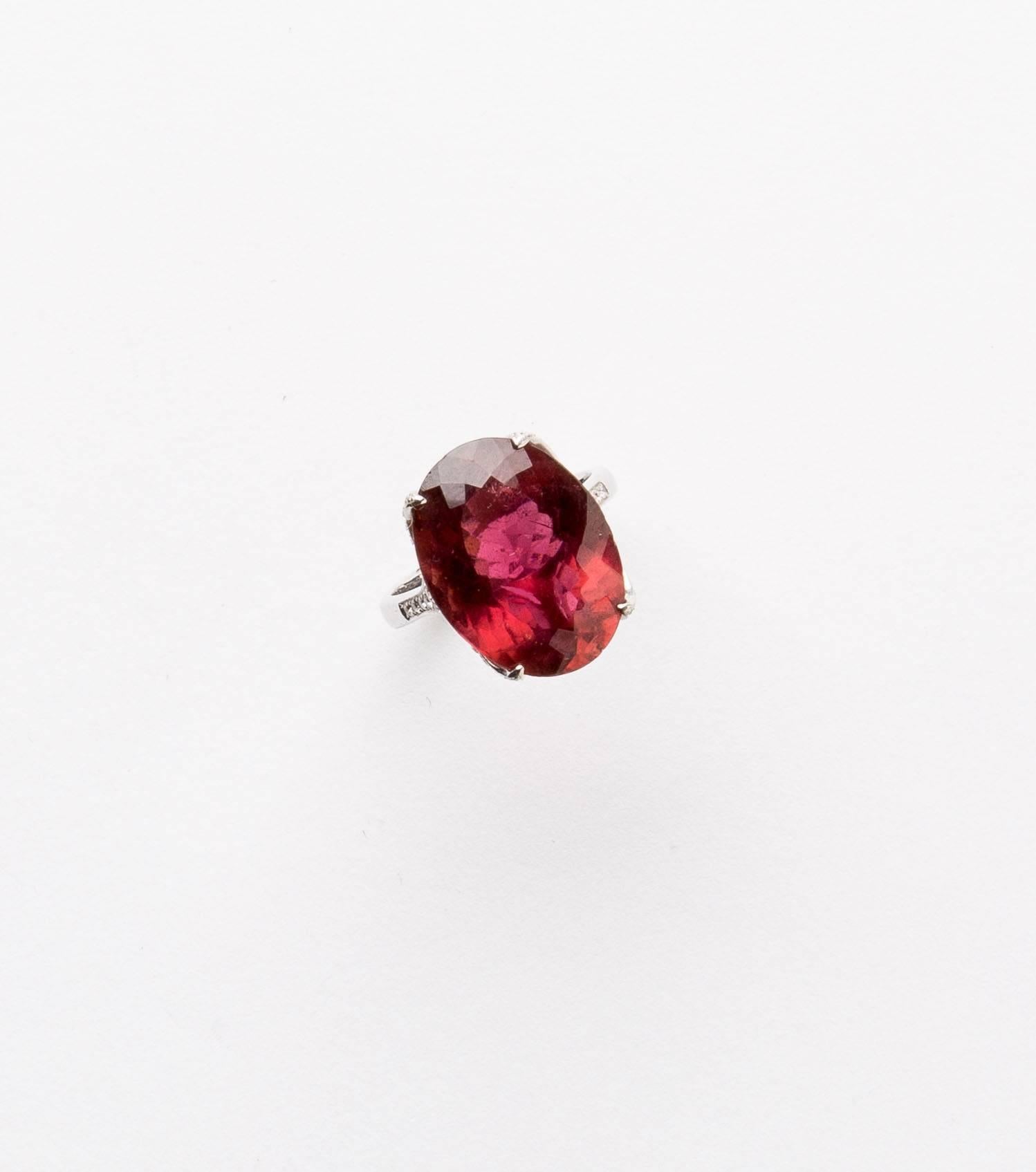 Unusual Color Tourmaline and Diamond Cocktail Ring approximately 11.98 carat stone.
The  Tourmaline is set with diamonds in an antique style setting.
