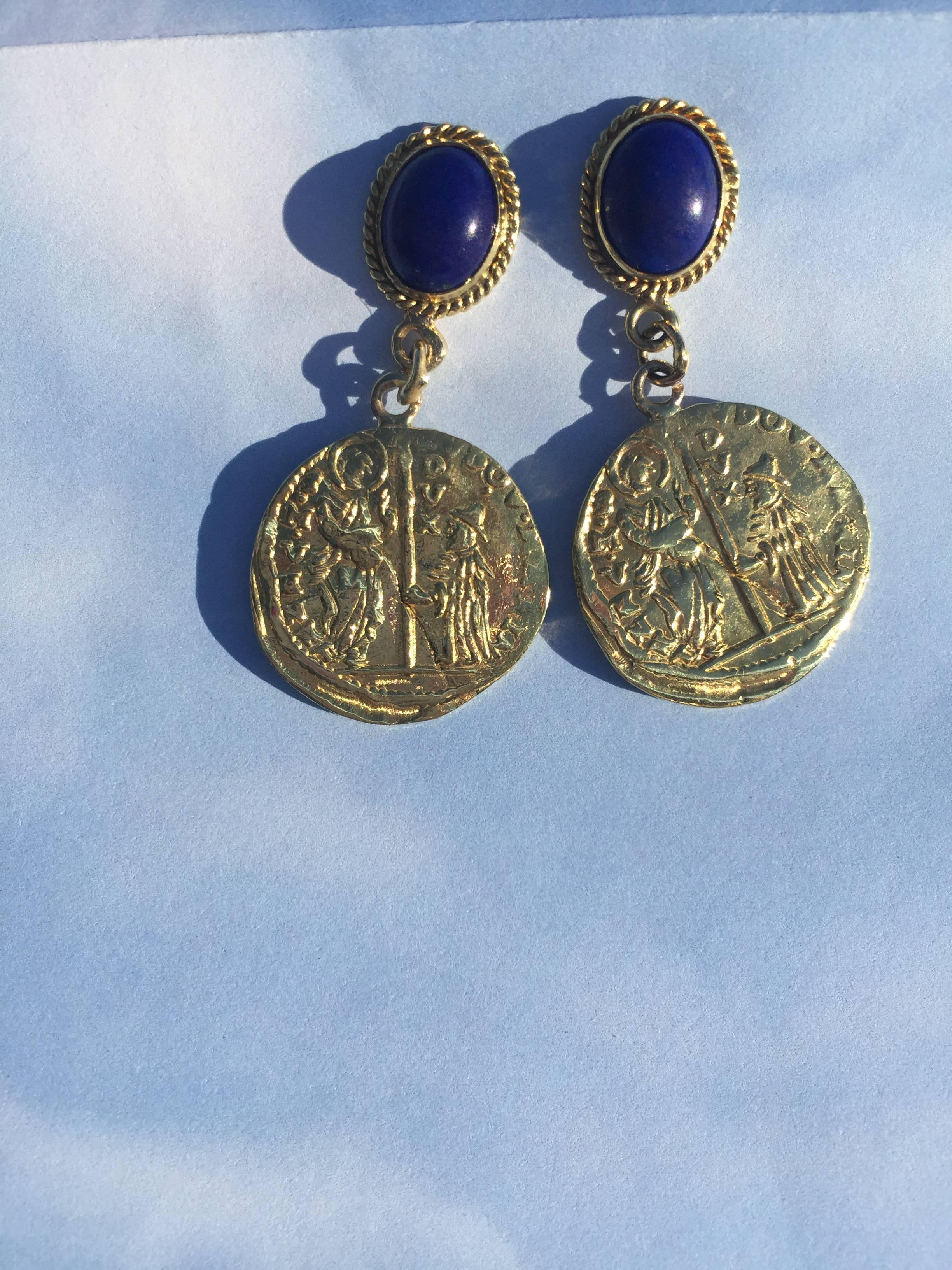 Exquisite for day or evening these 22mm coin earrings are cast from the original Venetian coin. the 6x8mm lapis cabochons are bezeled in 18K gold