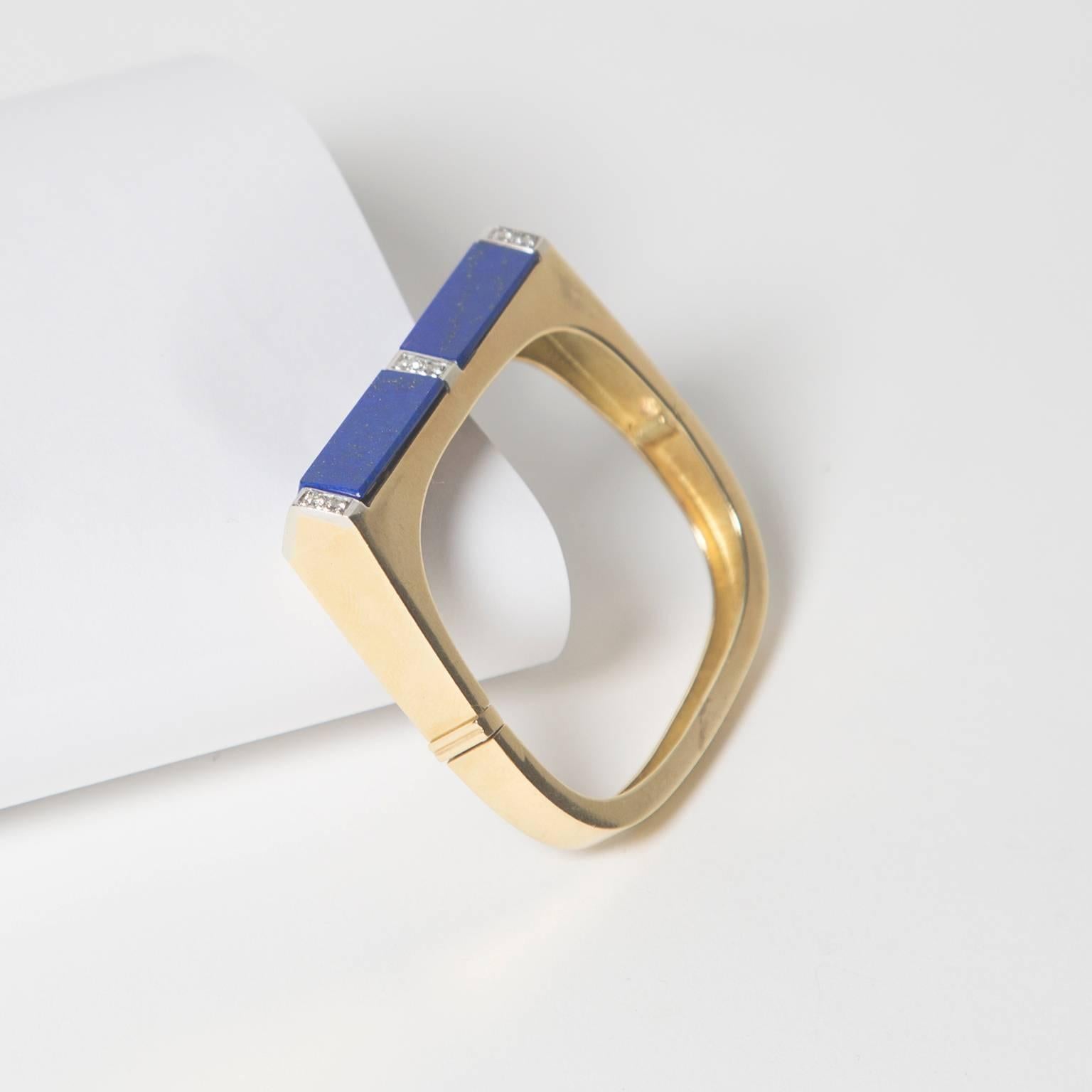 Solid 18K gold cuff inlaid with rich blue lapis and framed with diamonds. Fits a small wrist. 