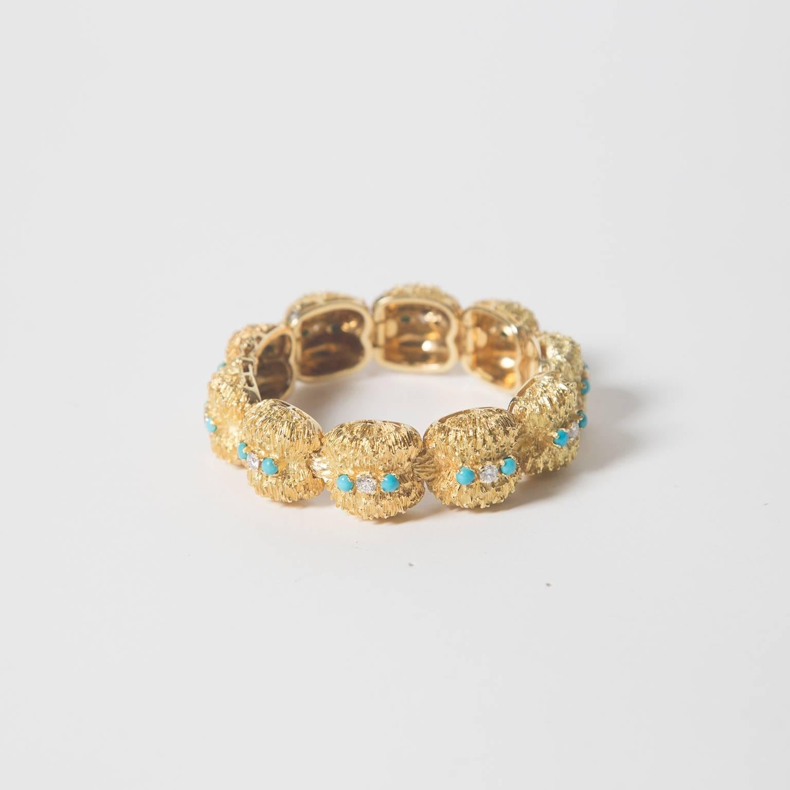 Heavy yet flexible brushed 18K gold bracelet, set with natural turquoise and diamonds. 