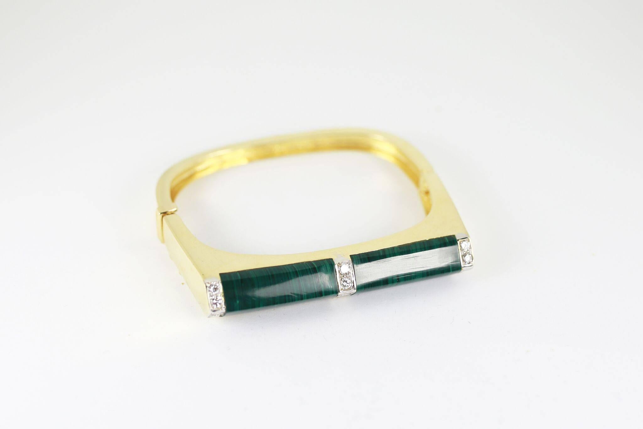 Solid 18K gold cuff inlaid with beautiful malachite and framed with diamonds. Fits a small wrist.