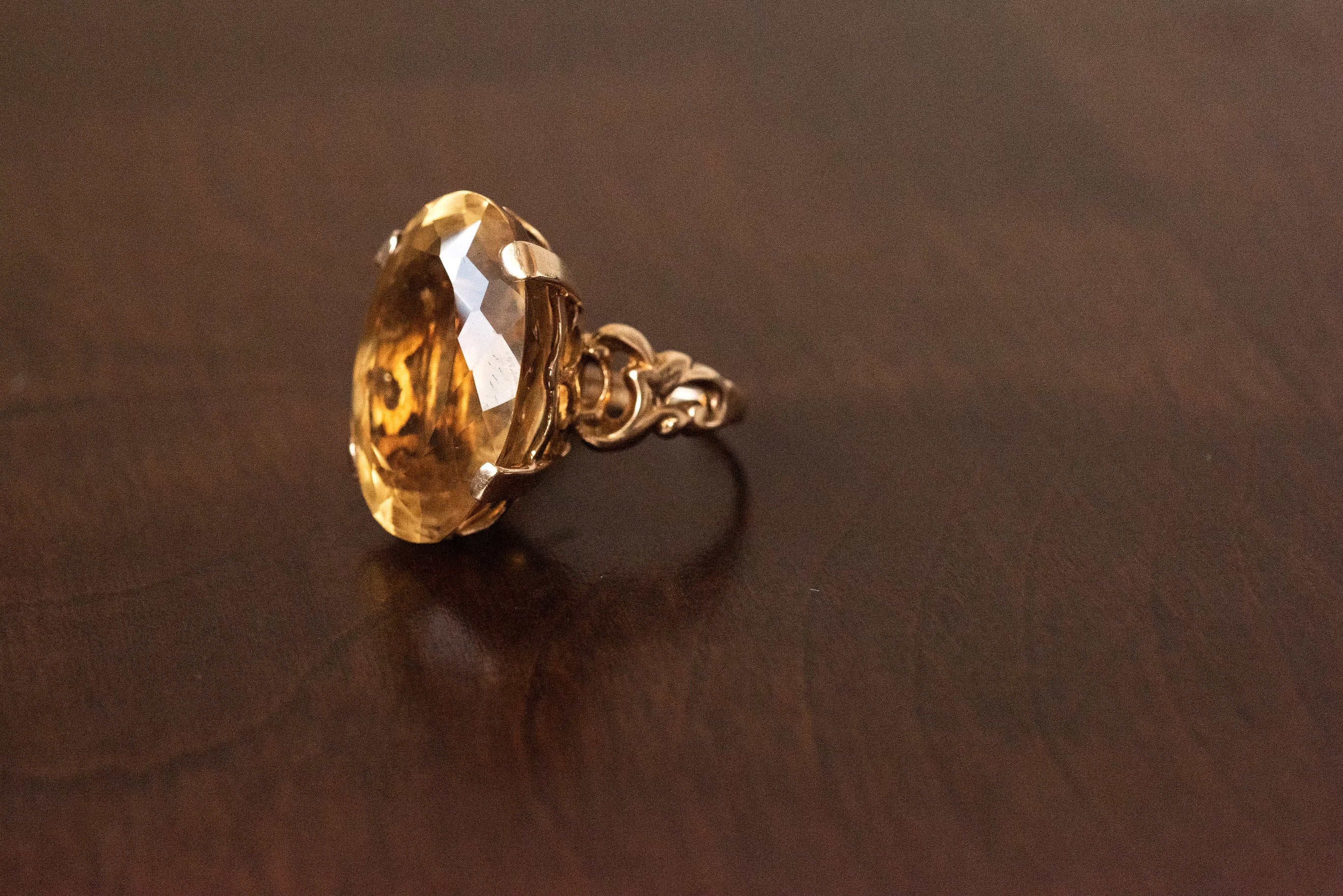 26ct oval sunflower colour citrine ring set in 10k yellow gold. The yellow of the citrine sparkles when it hits light. It is cut the old fashion way to let in lots of light and highlight the beauty of the stone. The colour is so uplifting and draws