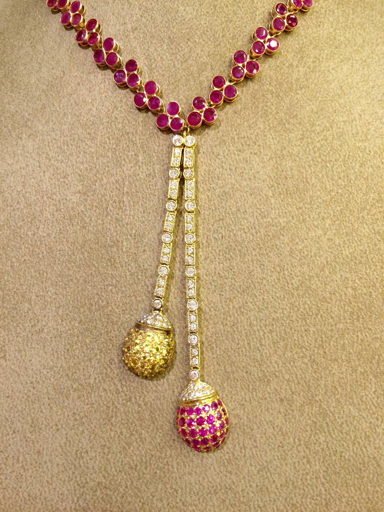 18k and 14k Gold Necklace with Bezel set Rubies and Diamonds. Pave set with Pink and Yellow Sapphires.