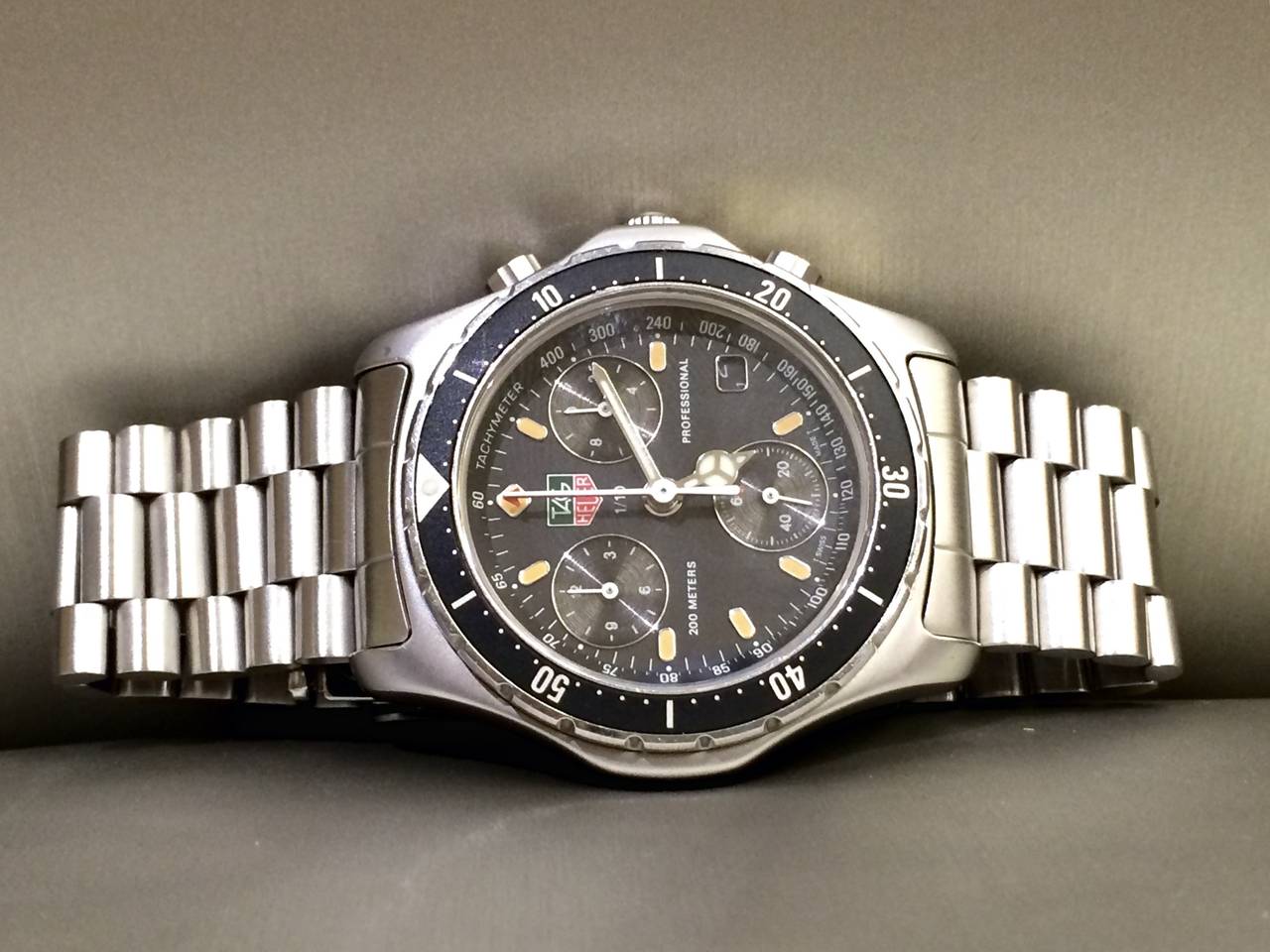 One Pre-Owned TAG Heuer Professional Wristwatch, Black Dial, Black Bezel, Quartz Movement, Comes with Box, As Pictured.
