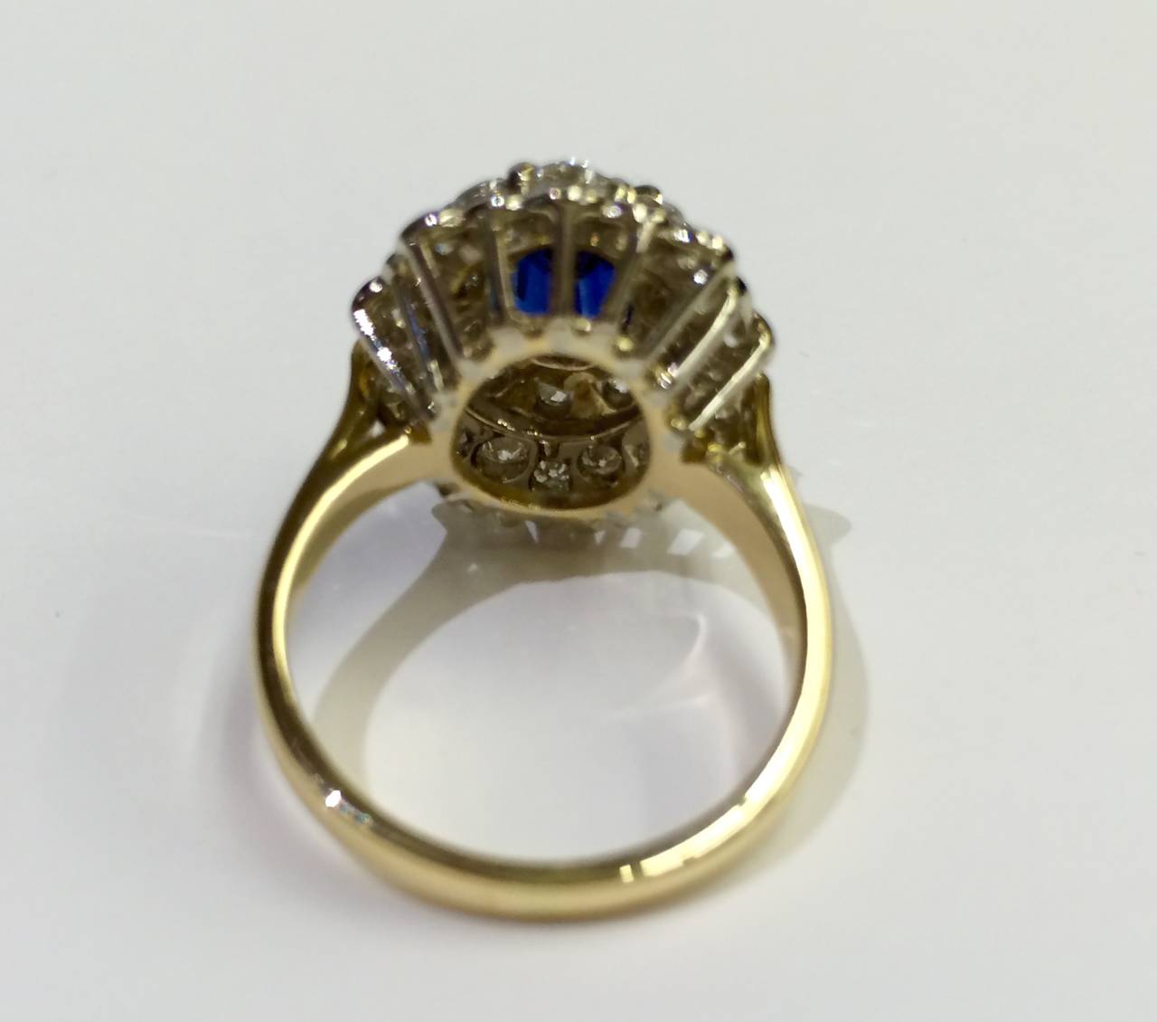 One estate diamond and blue sapphire ring, 18kt yellow and white gold,  2.06CT oval sapphire. Two carats total weight of diamonds VS-SI/ GH/ GD quality.  Currently a finger size of 7.5 which can be made bigger or smaller. This timeless piece could