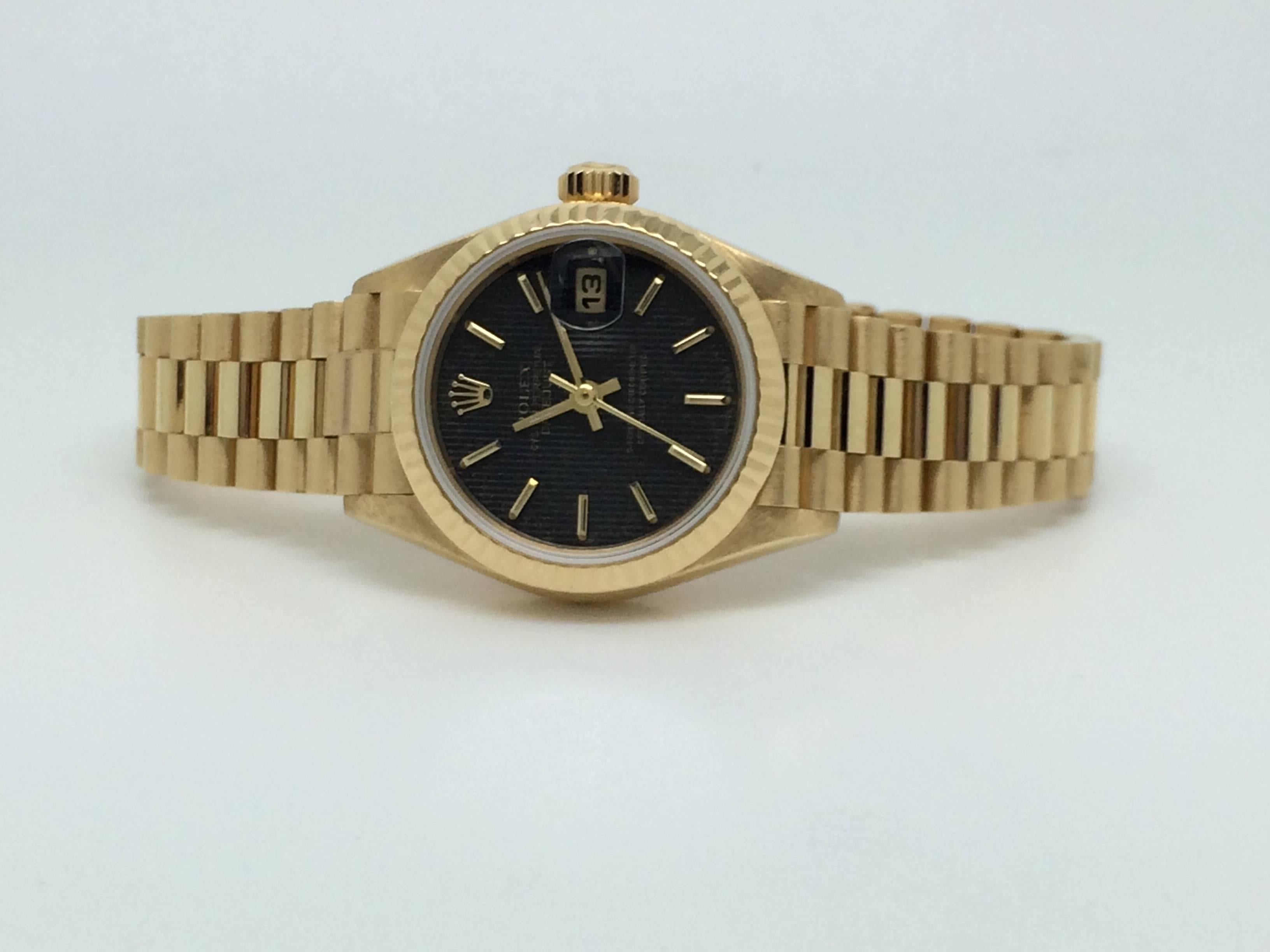 Rolex Yellow Gold Datejust President Wristwatch. 26mm diameter, automatic winding, fluted bezel, Rolex President bracelet. Timepiece features an original black dial, Pre-owned, circa 1993 and recently serviced by authorized Rolex technician. Model #