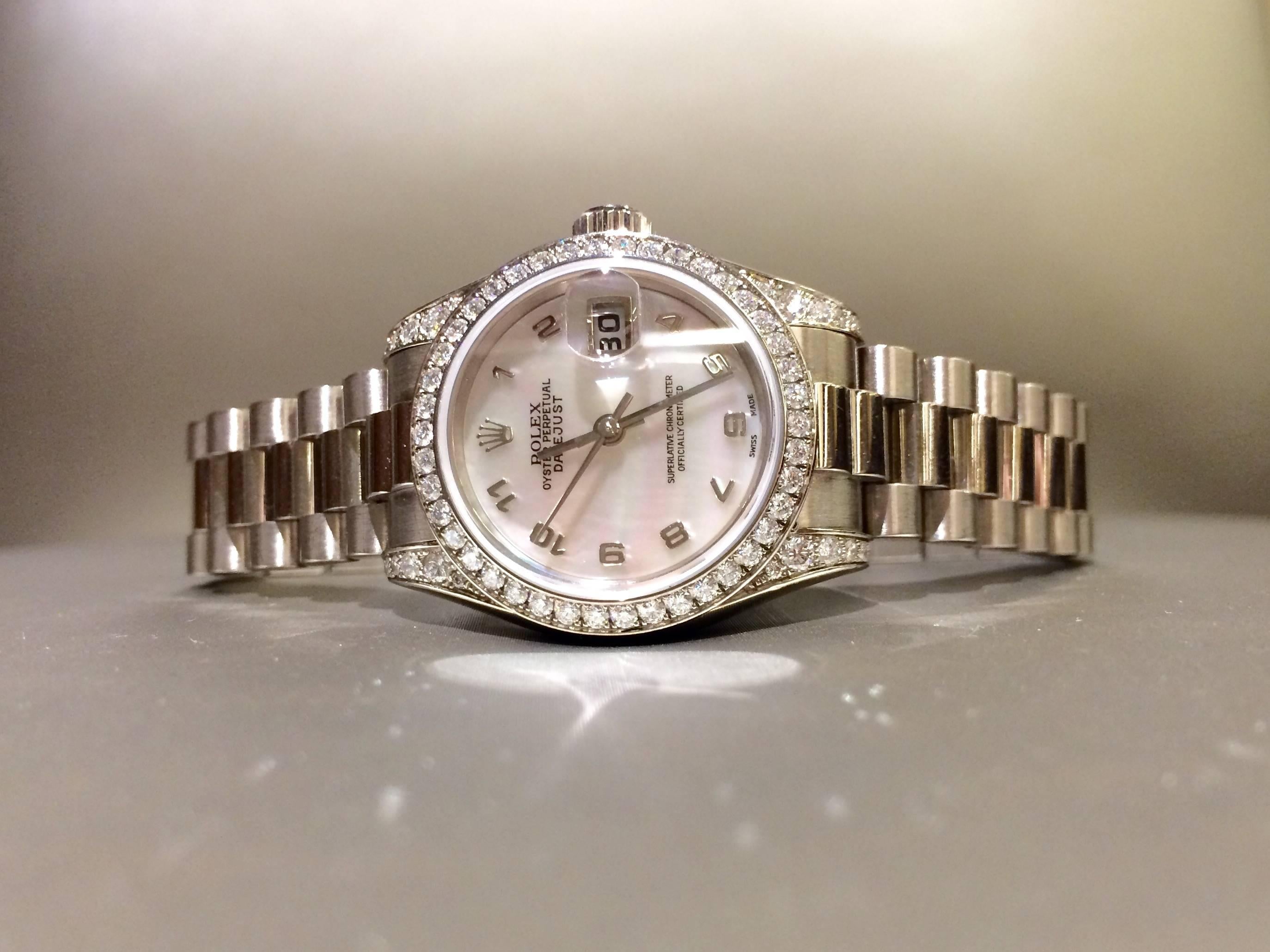 Pre-owned Rolex wristwatch. Mother of pearl dial, diamond bezel, Oyster bracelet, 18kt white gold, also comes with box. Model # 179239, Serial # K5632__