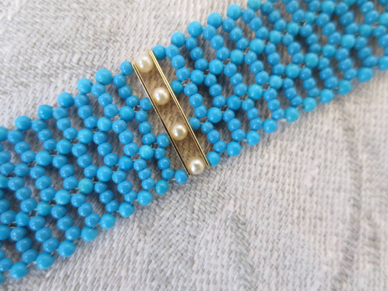 Contemporary Multi Strand Woven Turquoise Bracelet with Antique and Natural Pearl Gold Clasp
